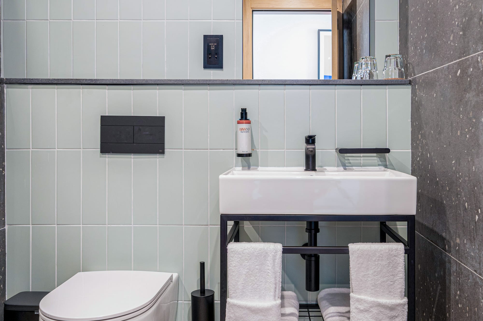 a bathroom with a sink and toilet