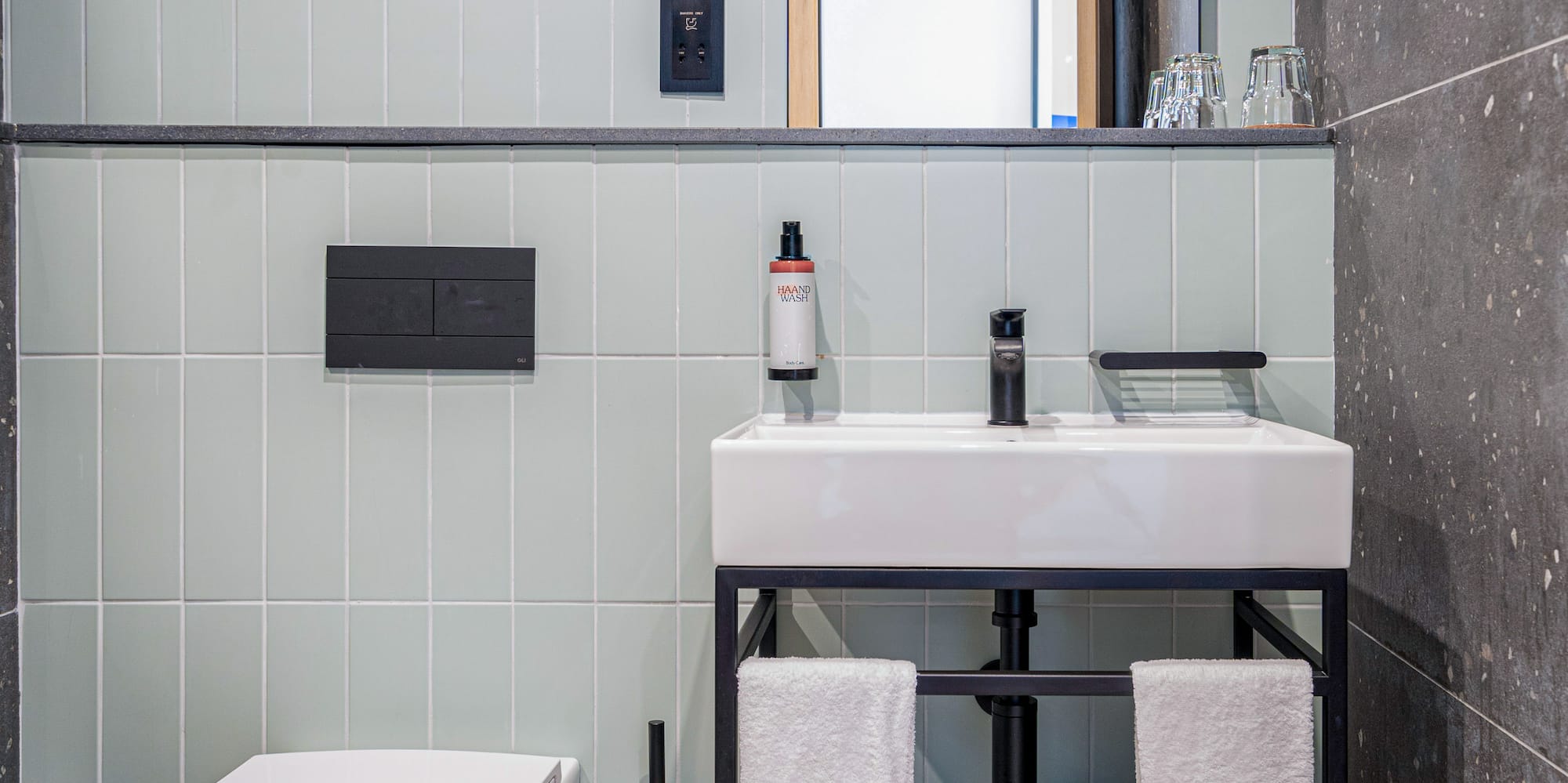 a bathroom with a sink and toilet