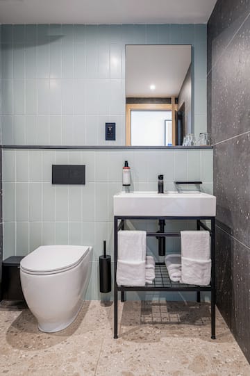 a bathroom with a sink and toilet