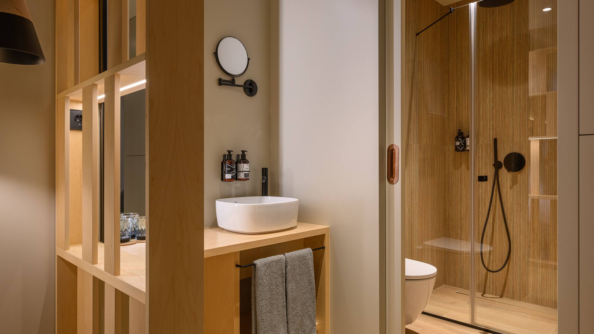 a bathroom with a shower and sink