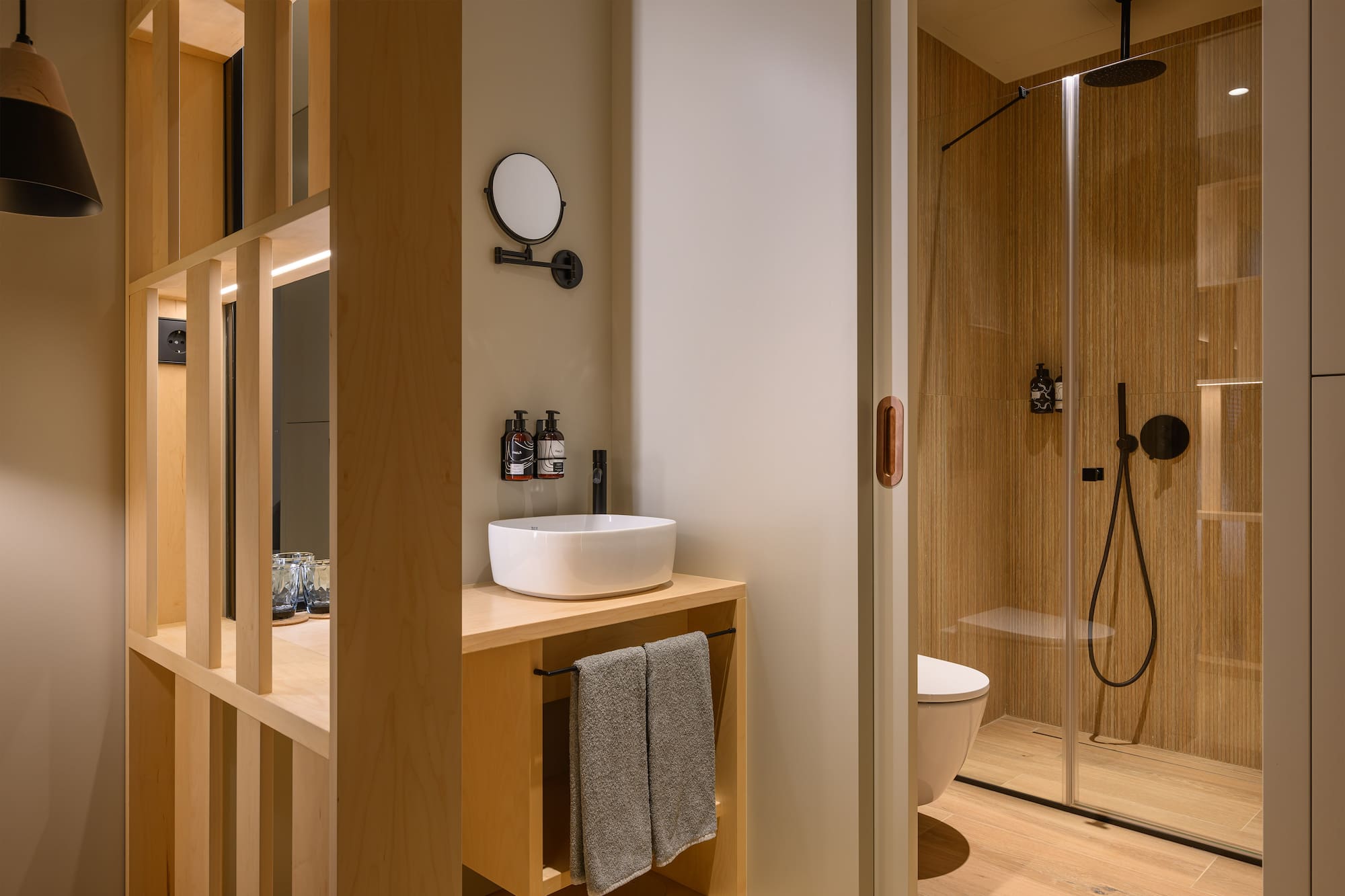 a bathroom with a shower and sink