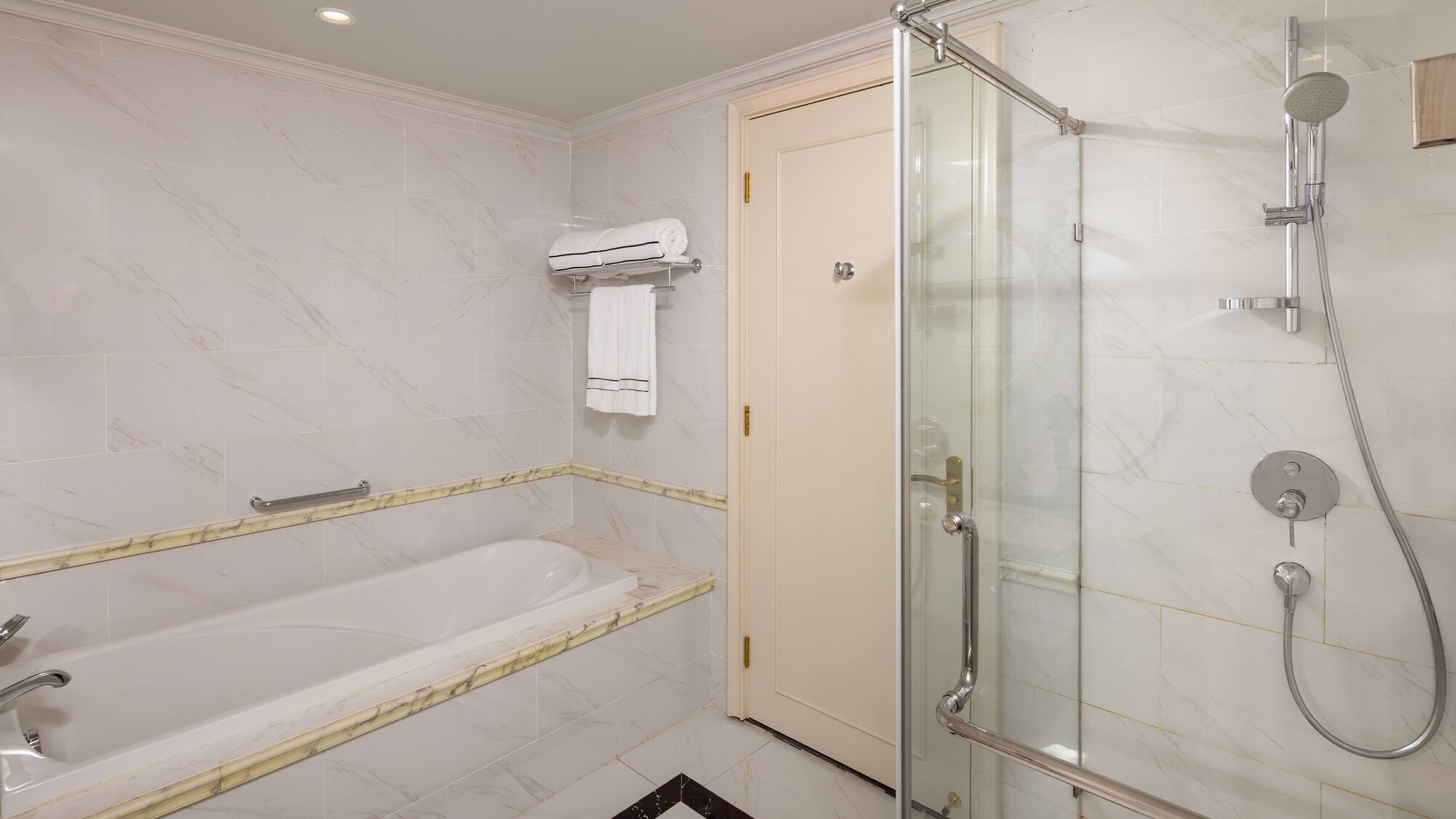 a bathroom with a bathtub and shower