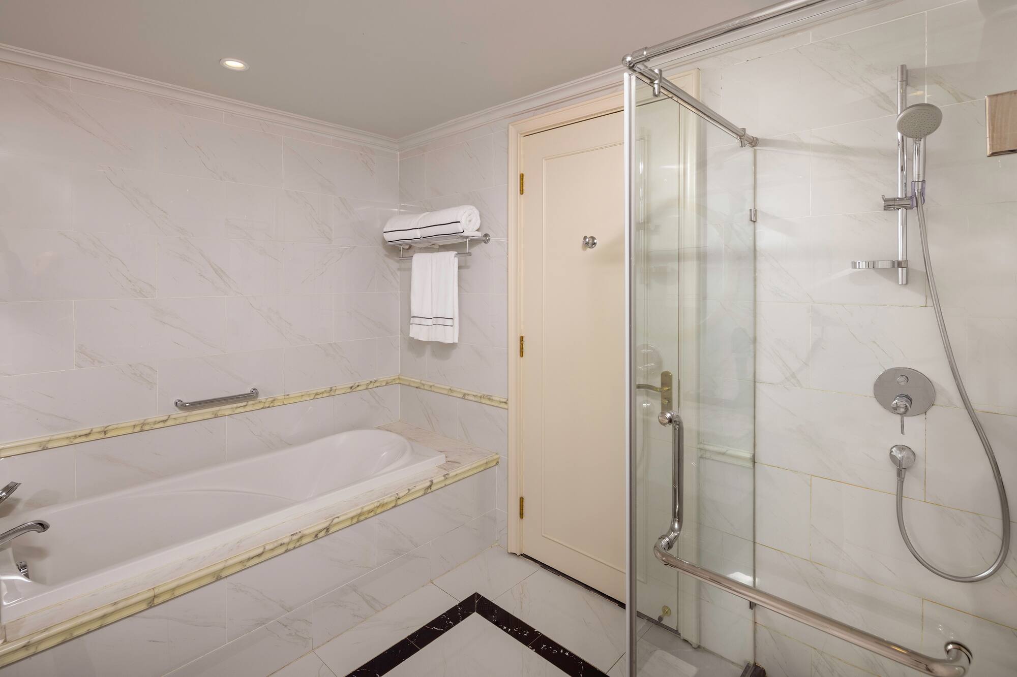 a bathroom with a bathtub and shower