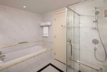 a bathroom with a bathtub and shower