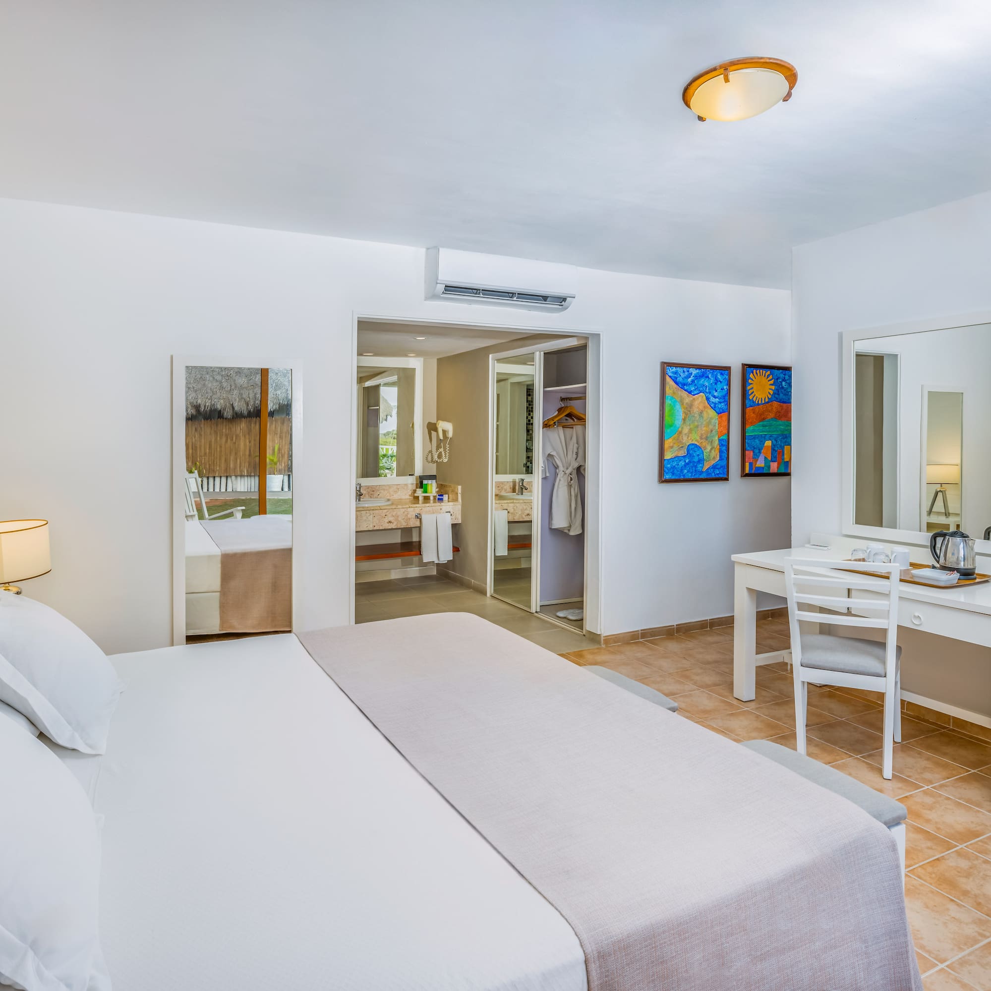 a room with a bed and a mirror