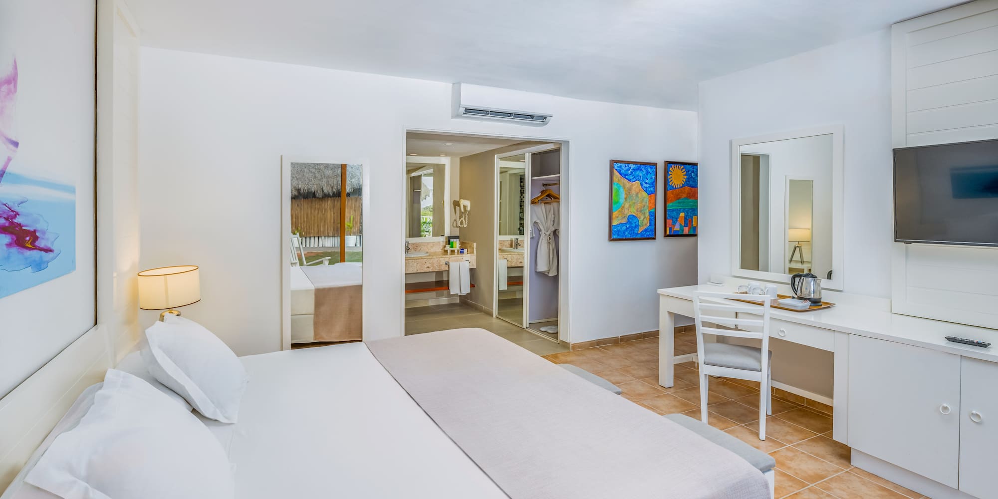 a room with a bed and a mirror