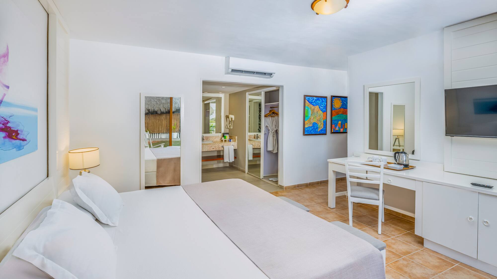 a room with a bed and a mirror