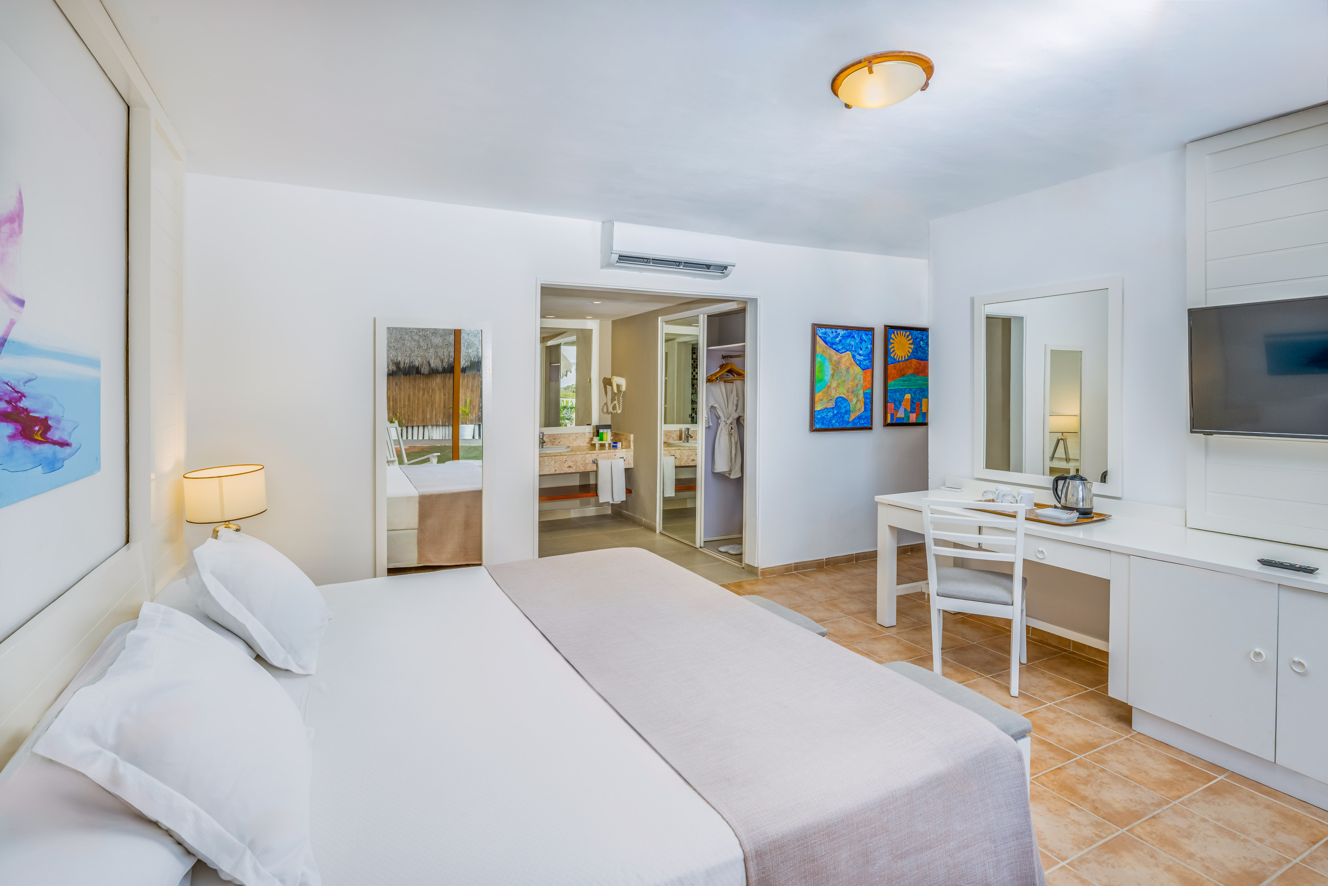 a room with a bed and a mirror