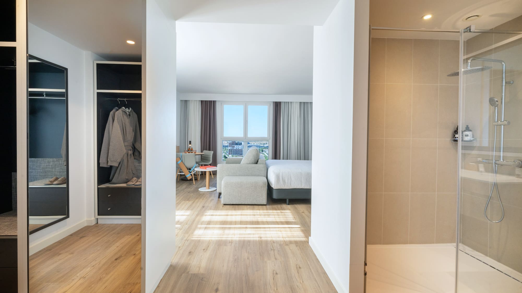 a room with a bed and a shower