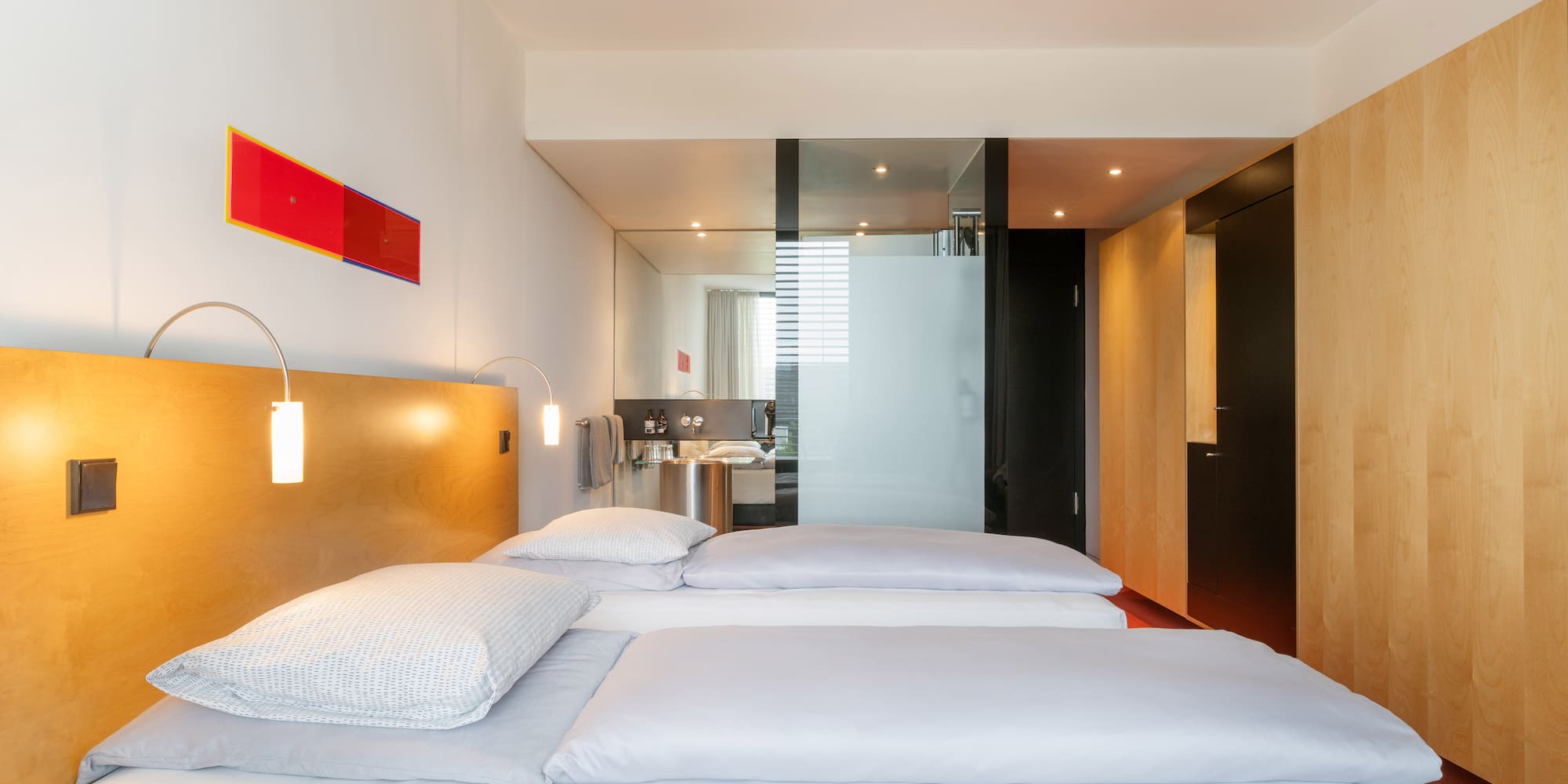 a room with a bed and a mirror