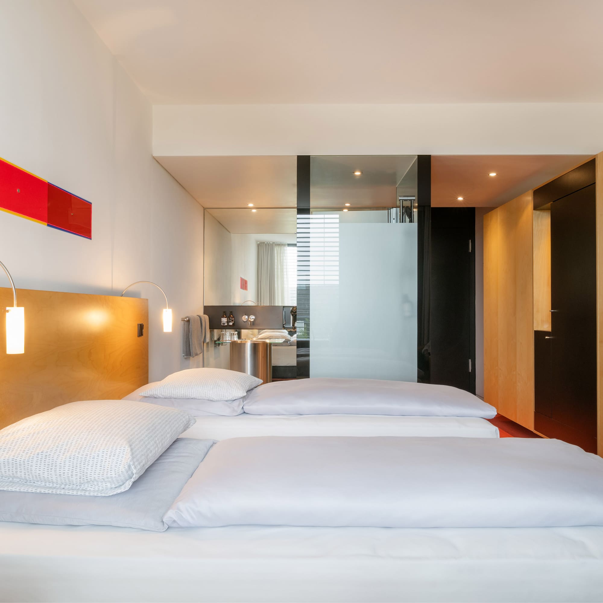 a room with a bed and a mirror