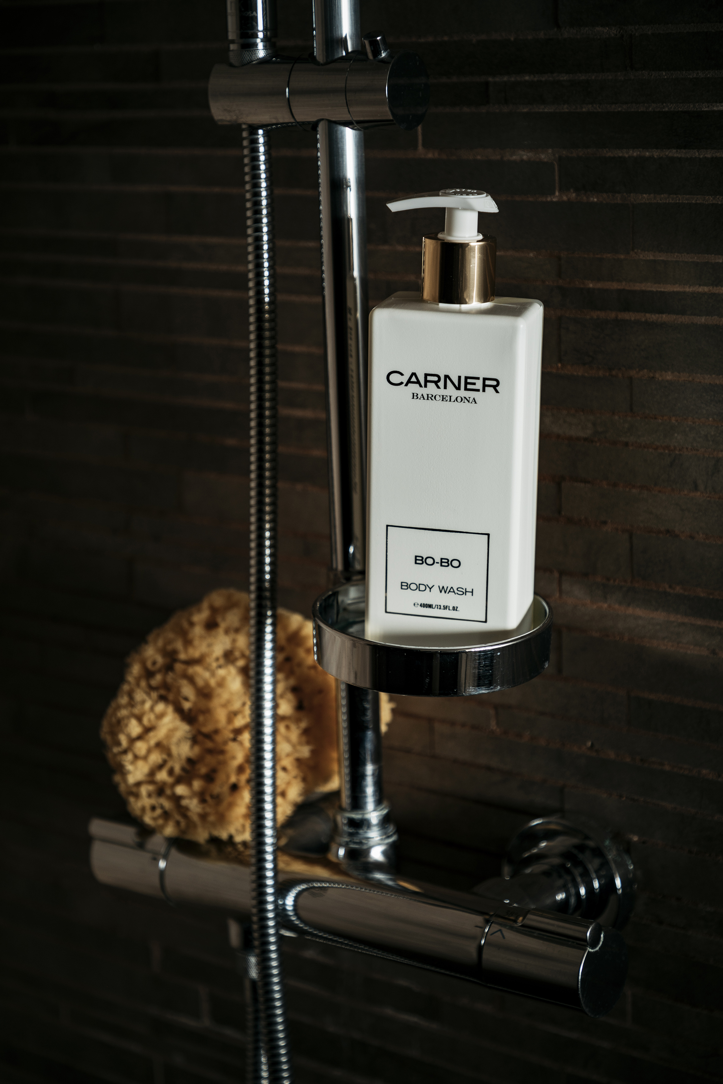 a white bottle of liquid on a metal shelf