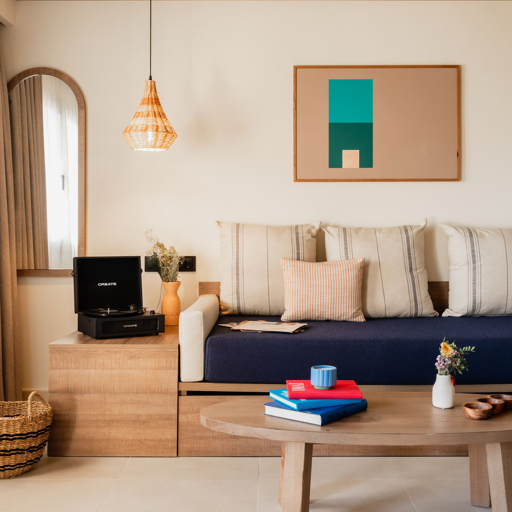a couch with pillows and a coffee table