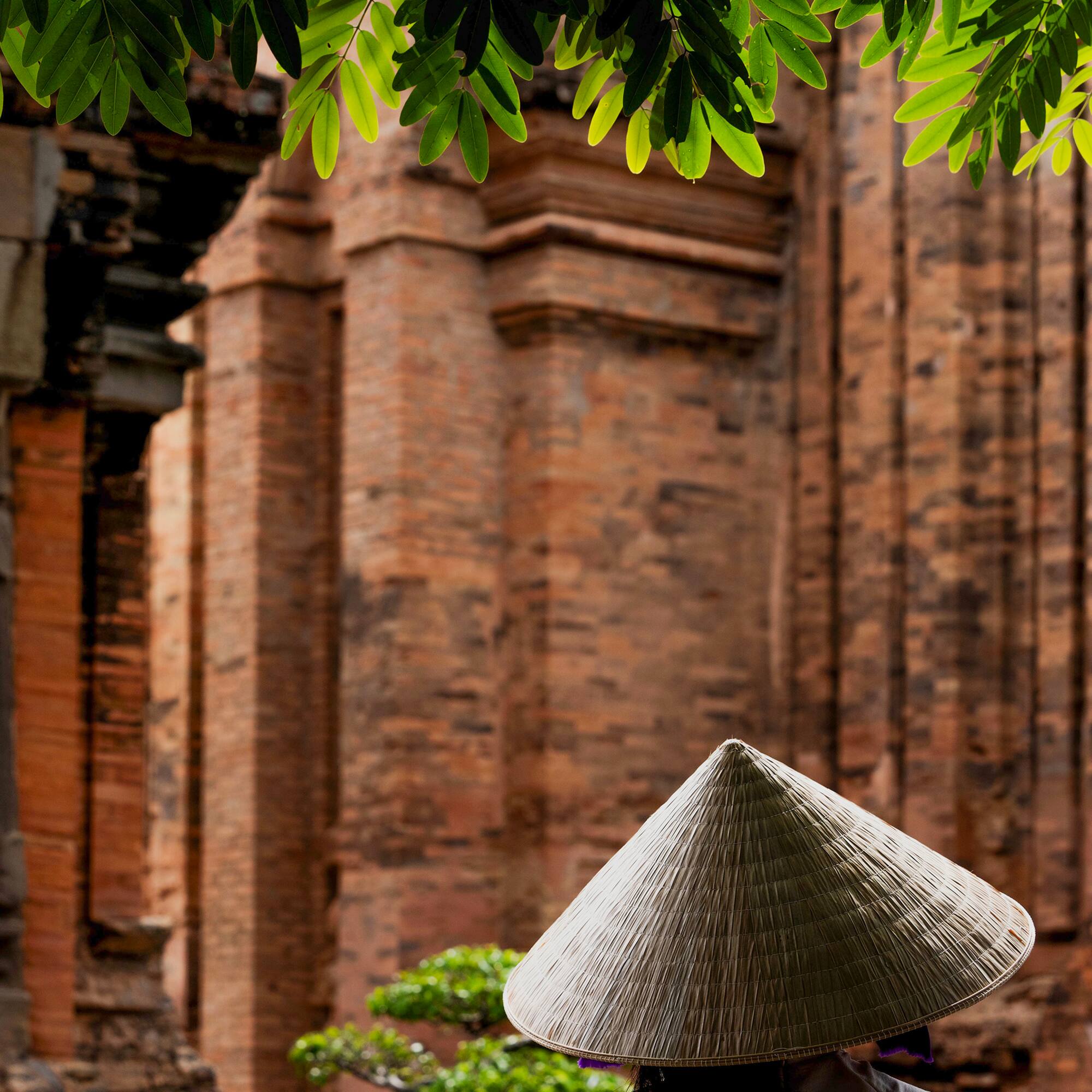 a person wearing a conical hat