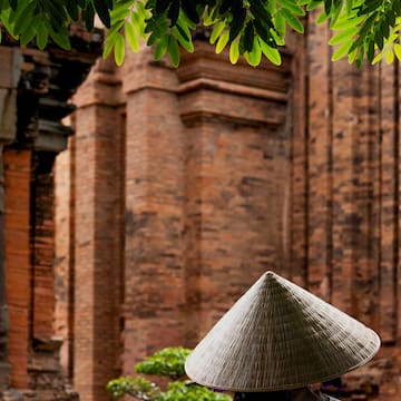 a person wearing a conical hat