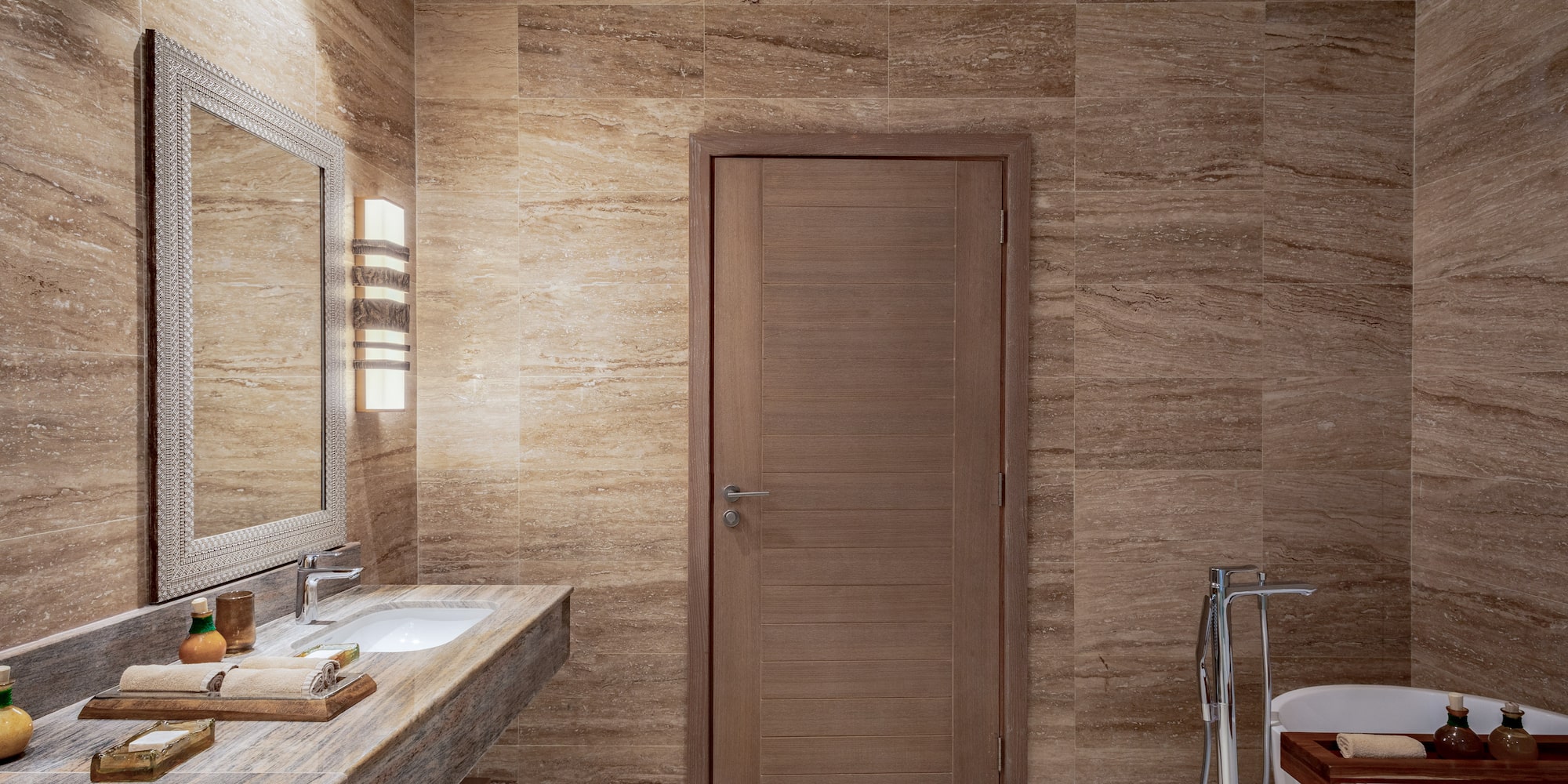 a bathroom with a door and sink