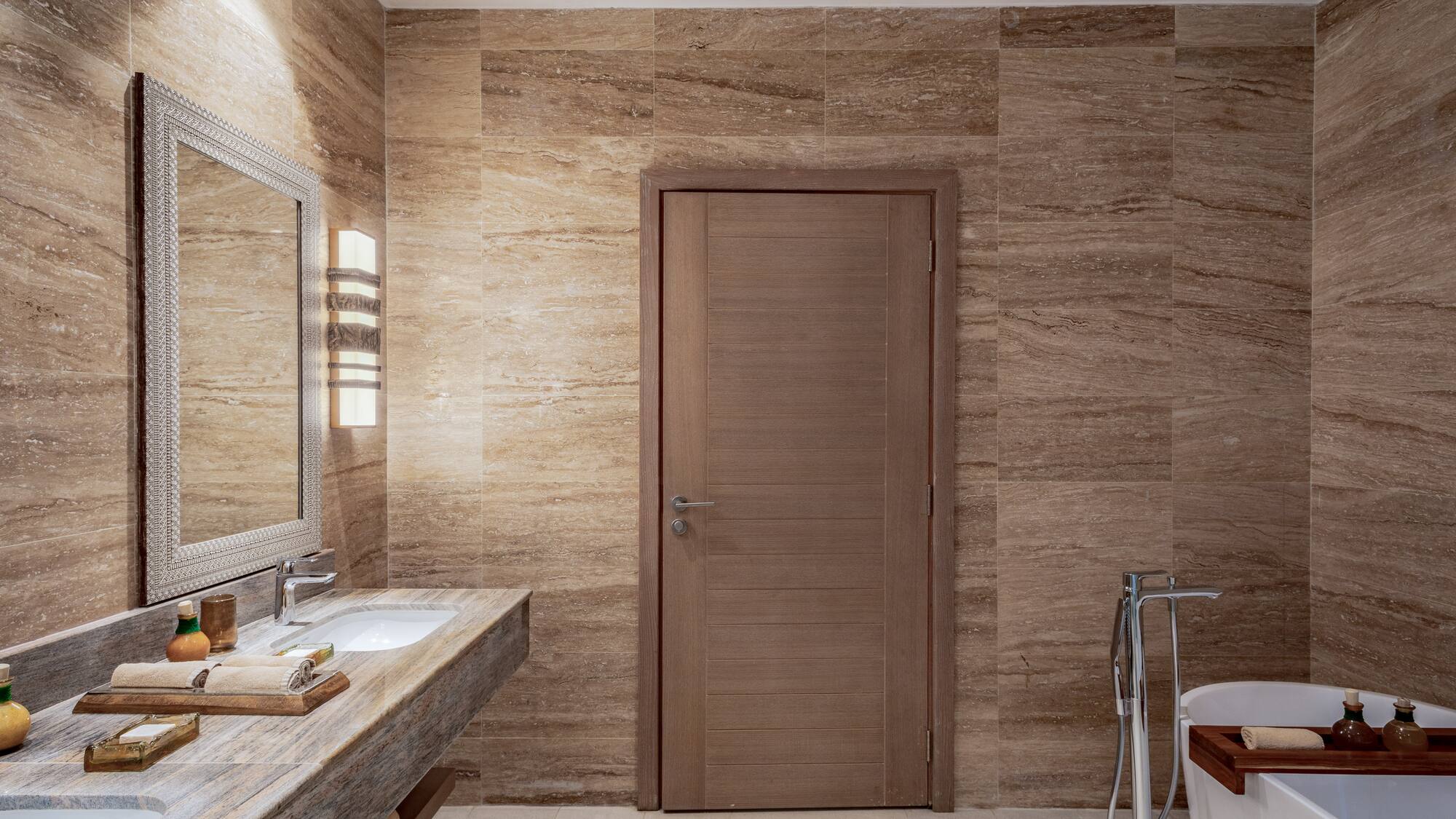 a bathroom with a door and sink