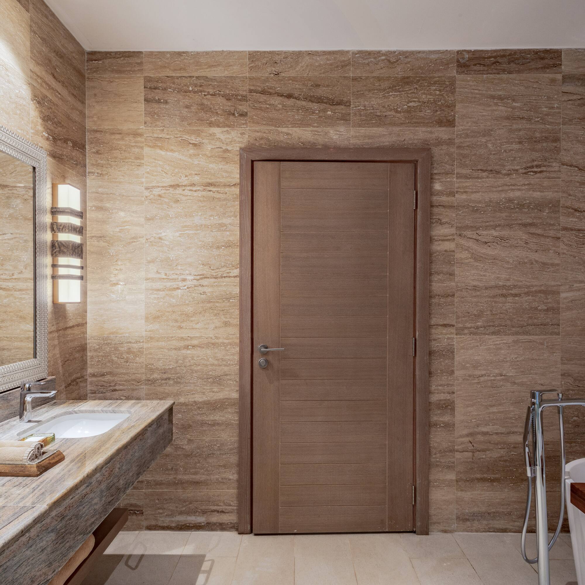 a bathroom with a door and sink