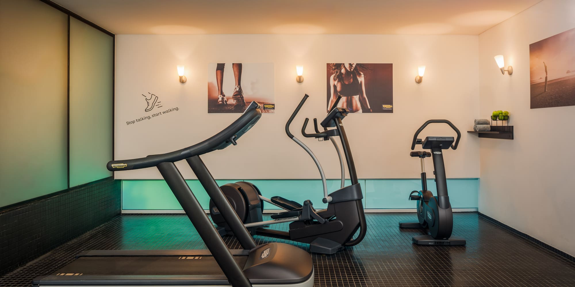 a room with exercise machines and a white board