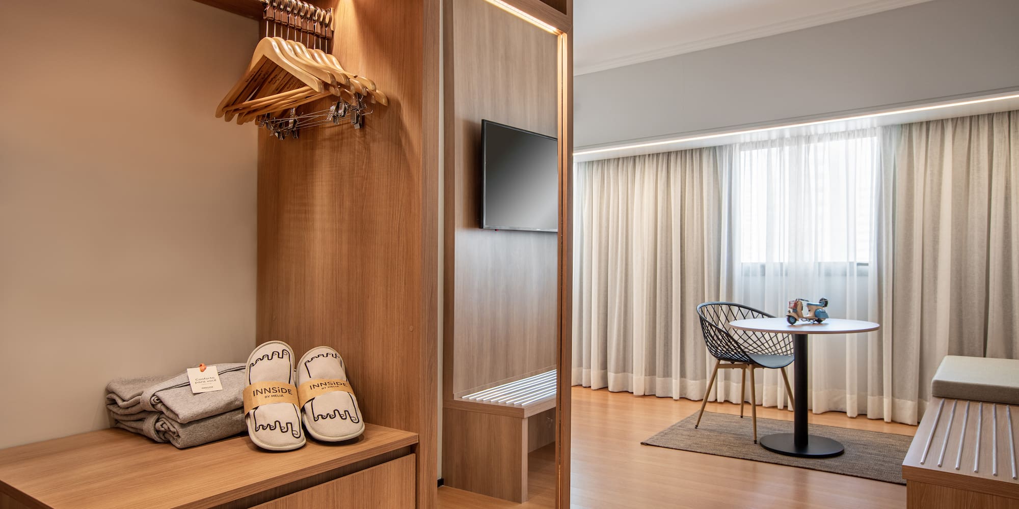 a room with a closet and a tv