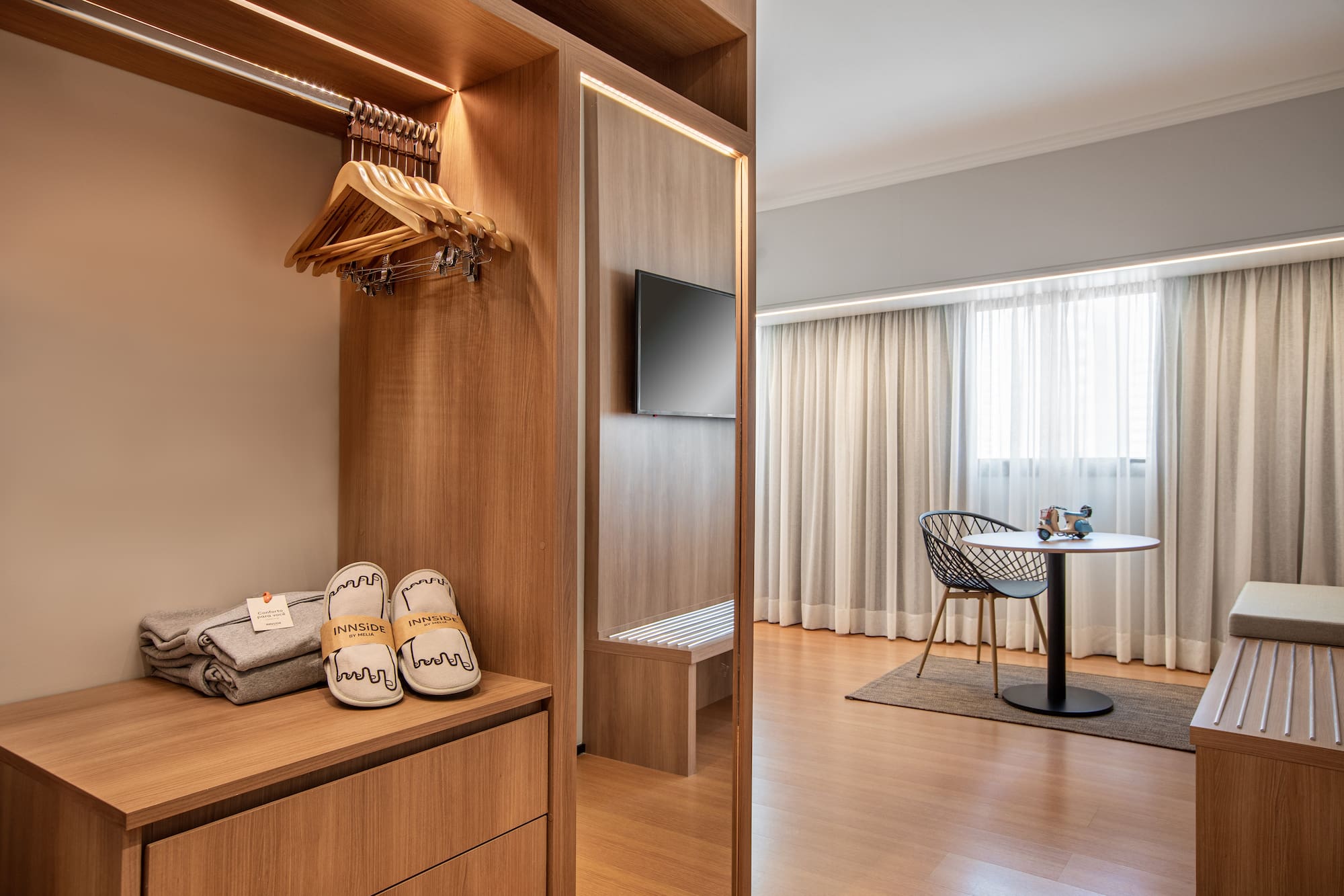 a room with a closet and a tv