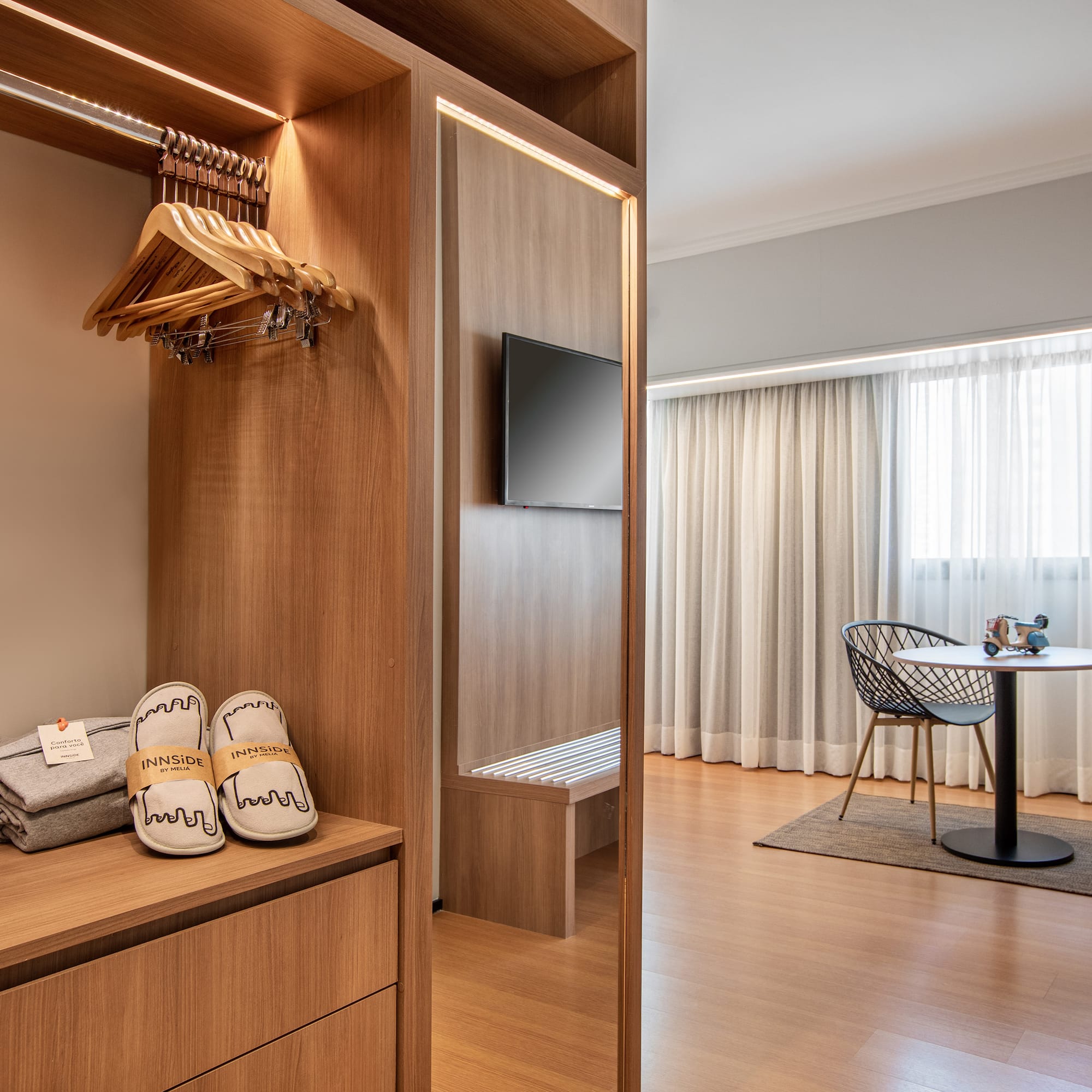 a room with a closet and a tv