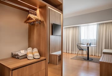 a room with a closet and a tv