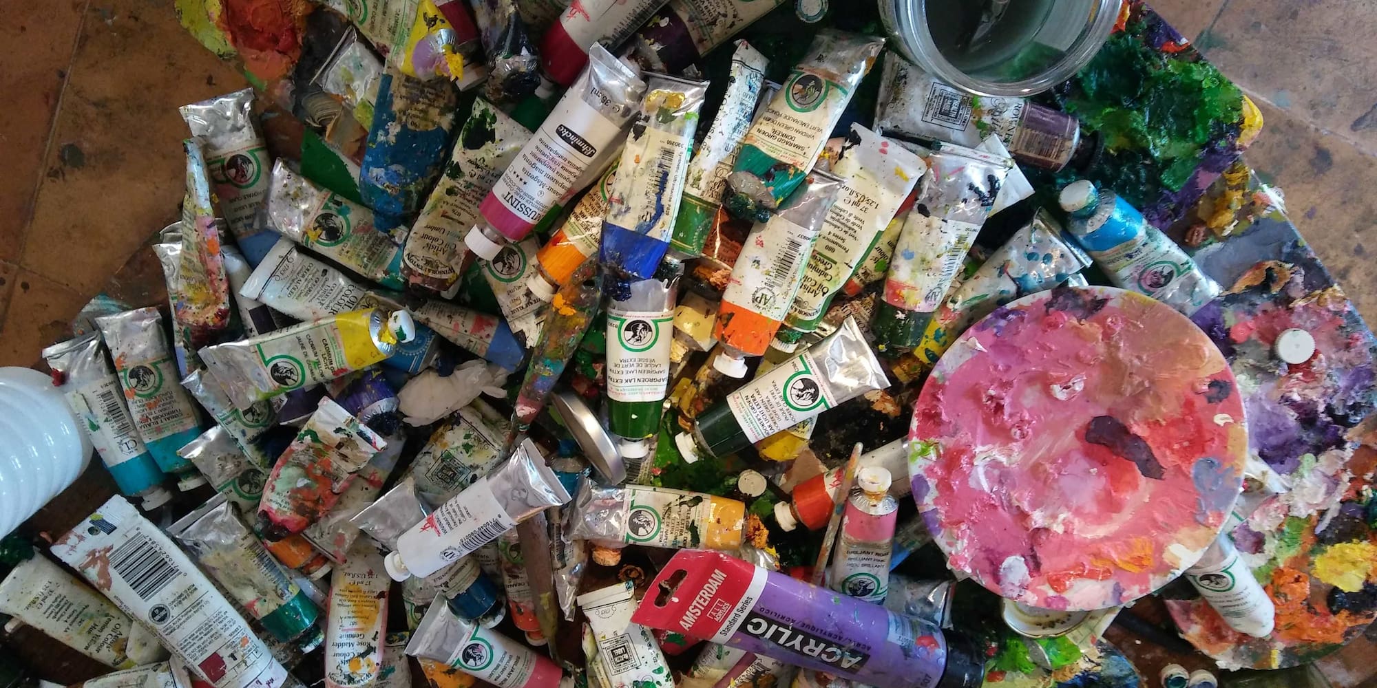 a group of tubes of paint