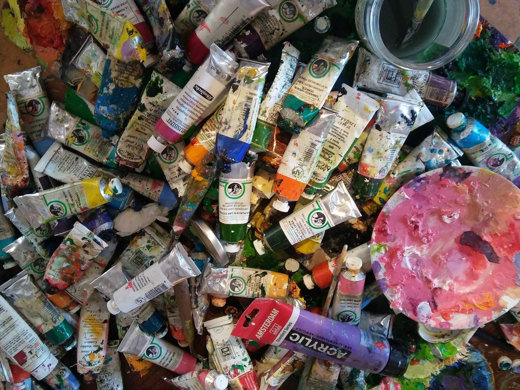 a group of tubes of paint