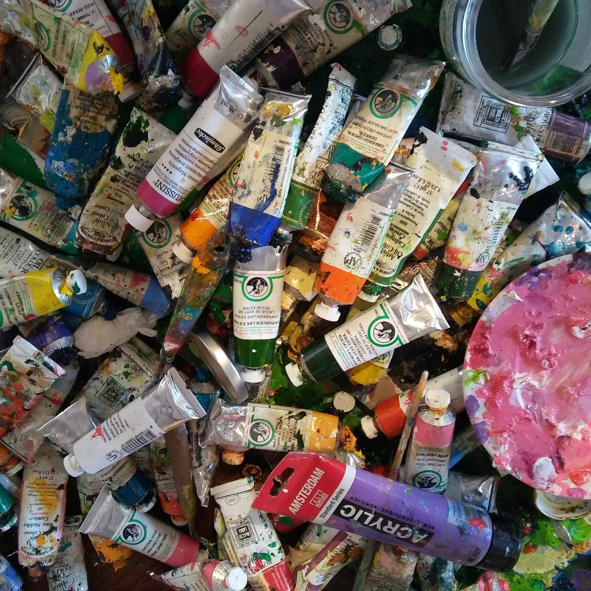 a group of tubes of paint