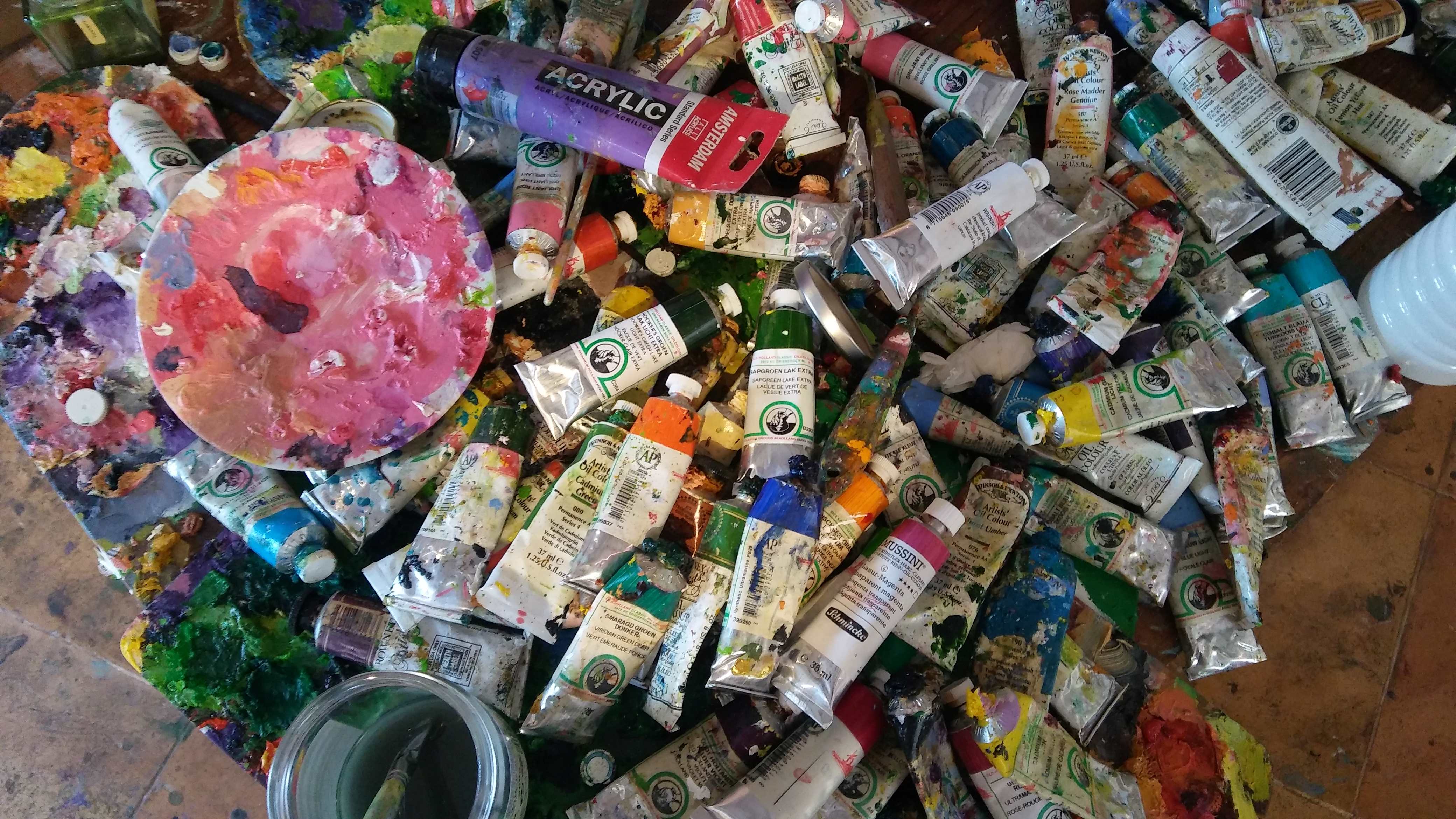 a group of tubes of paint