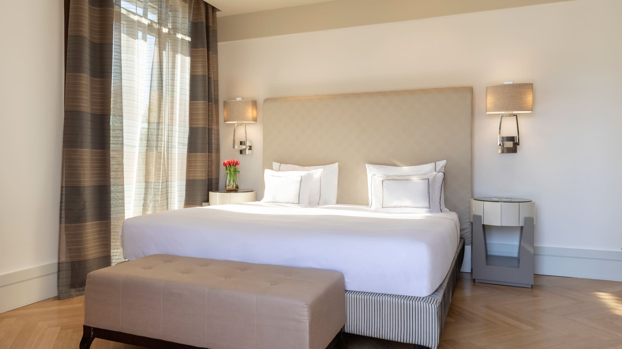 a bed with a bench in a room