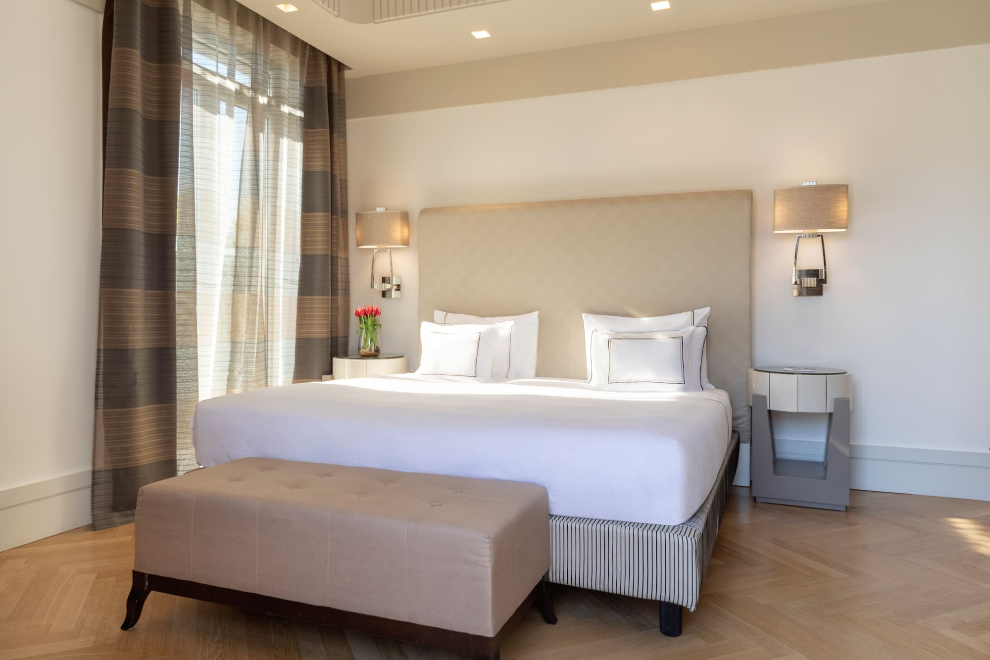 a bed with a bench in a room