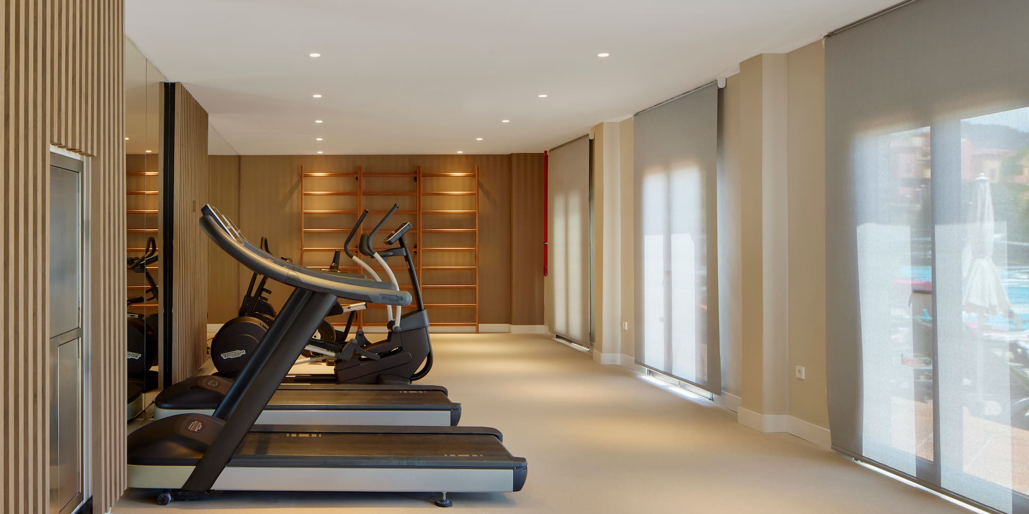 a room with treadmills and exercise machines