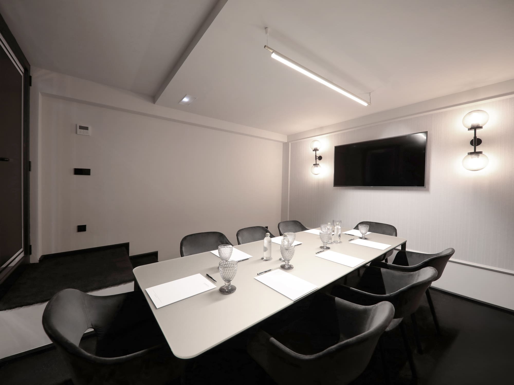 a room with a table and chairs