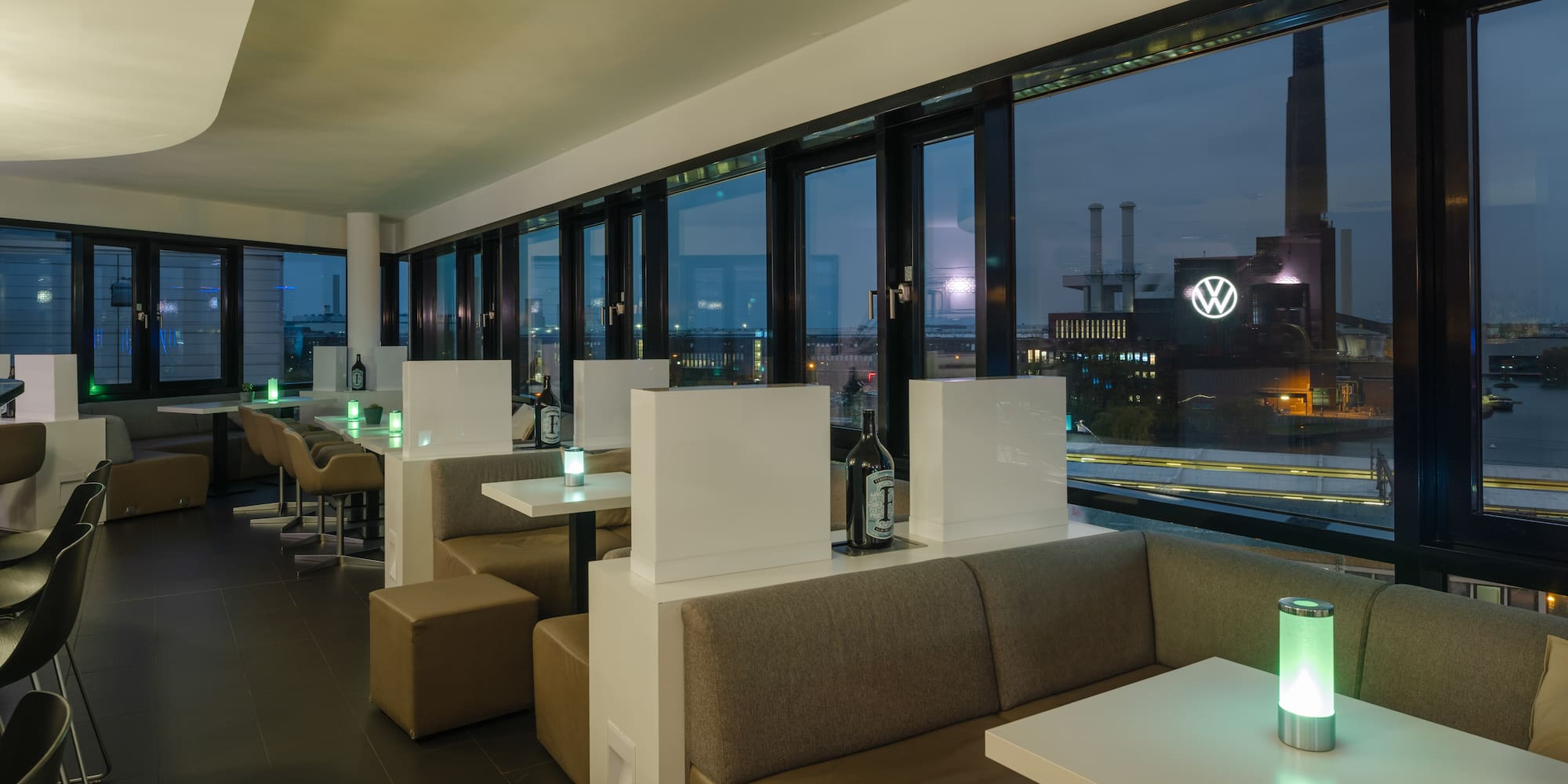 a room with tables and chairs and a window