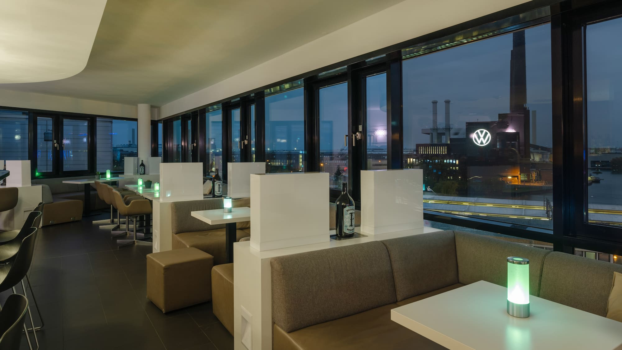 a room with tables and chairs and a window
