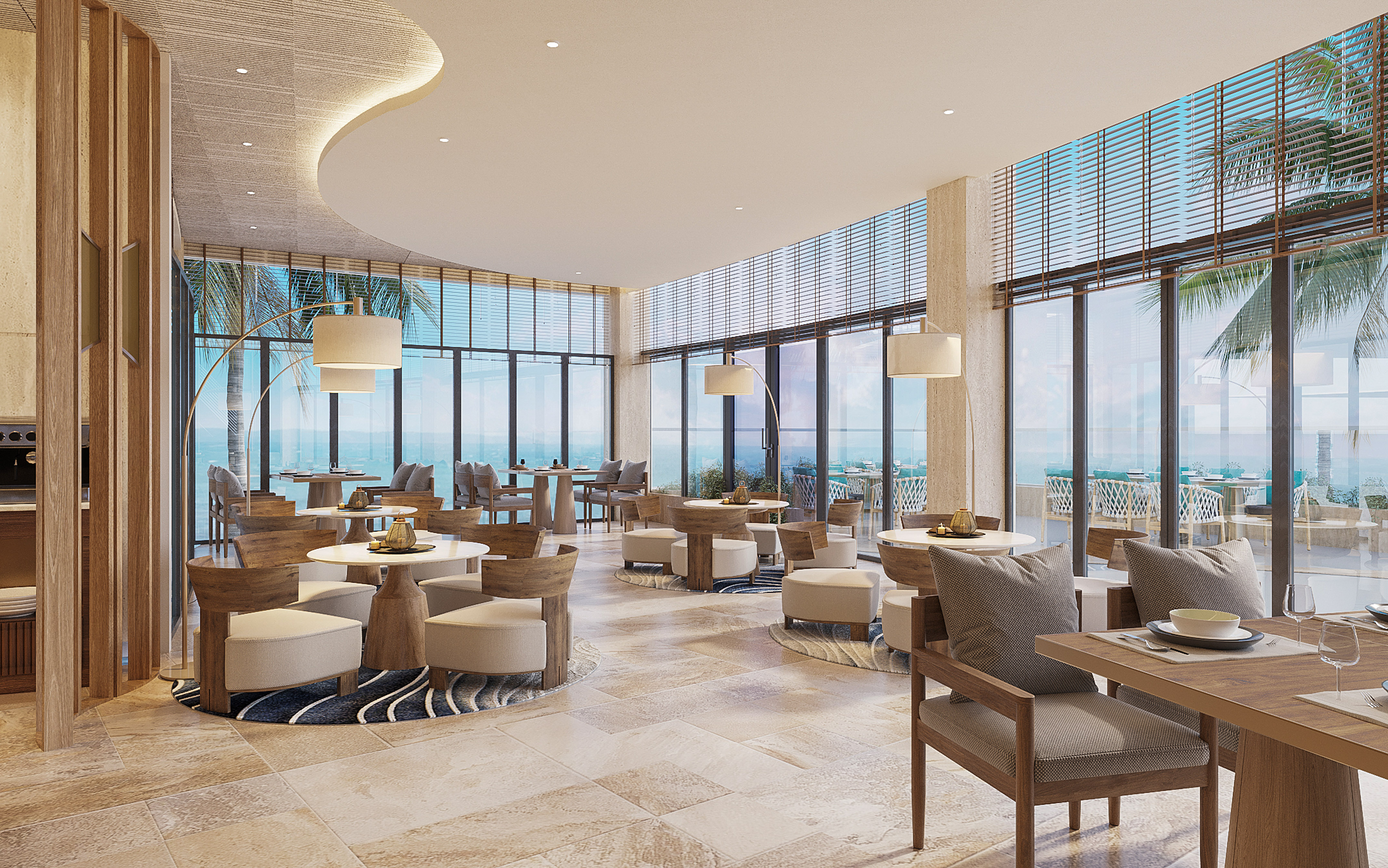 Modern ocean view restaurant with elegant wooden tables and chairs.
