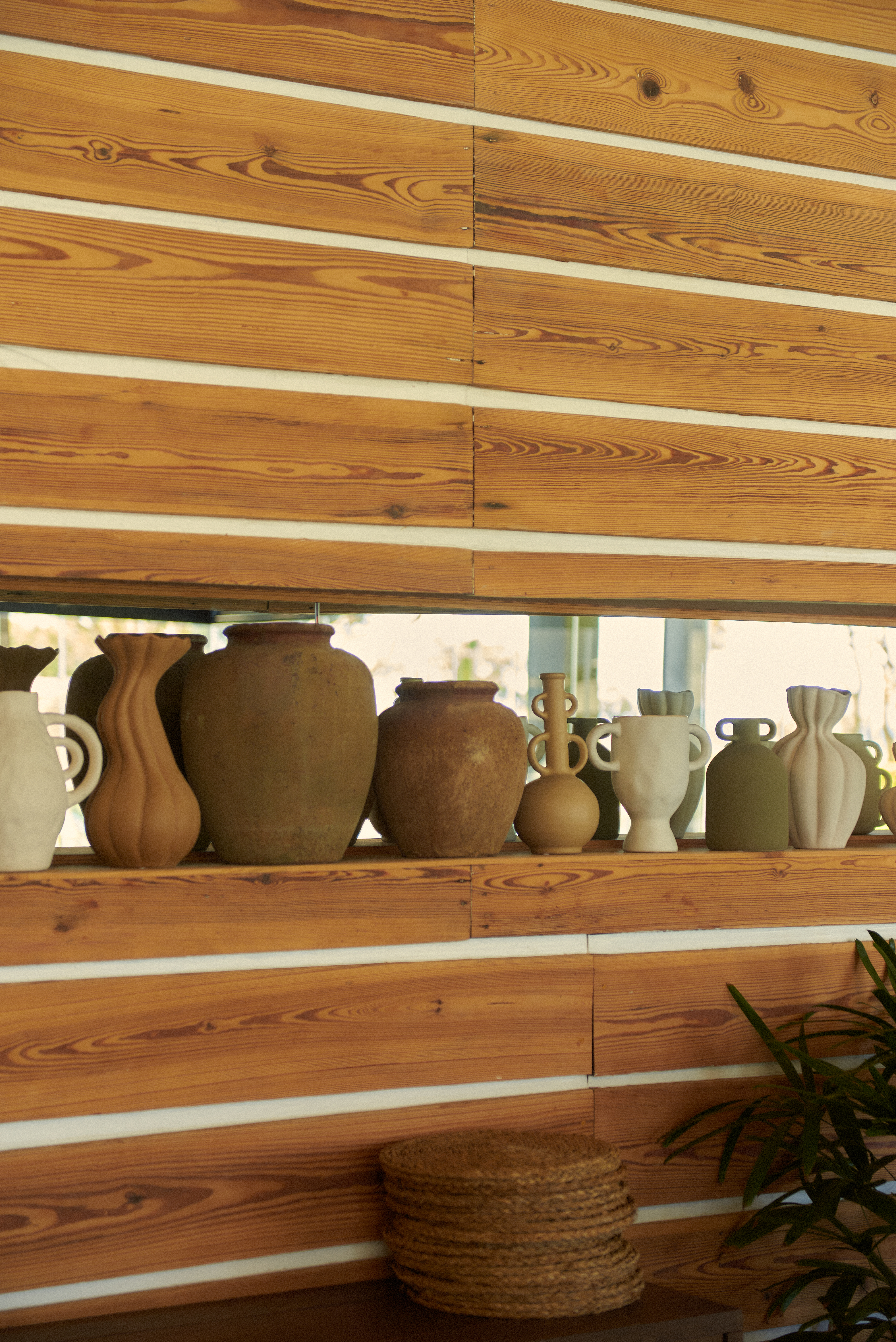 a group of vases on a shelf