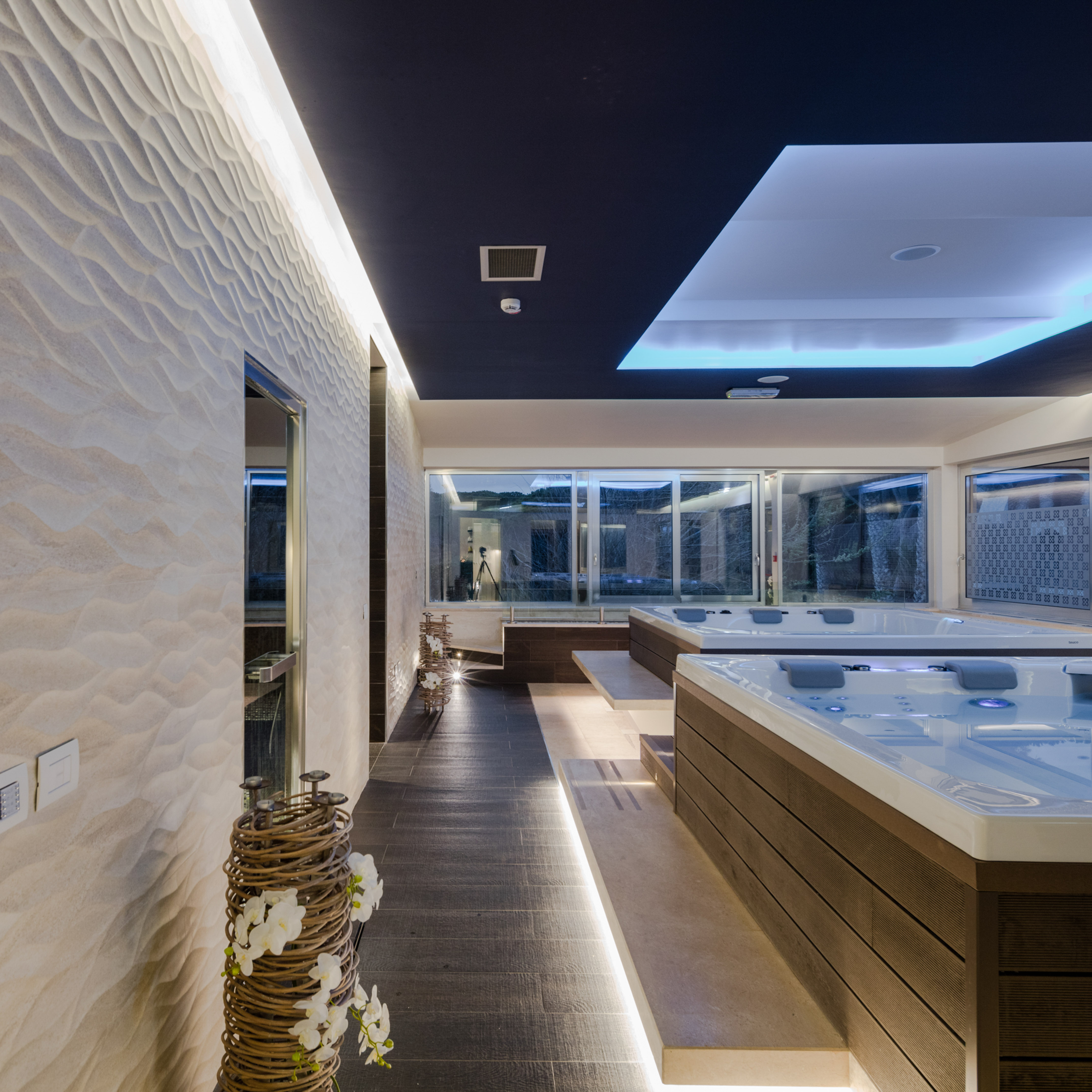 a room with a large tub and a large window