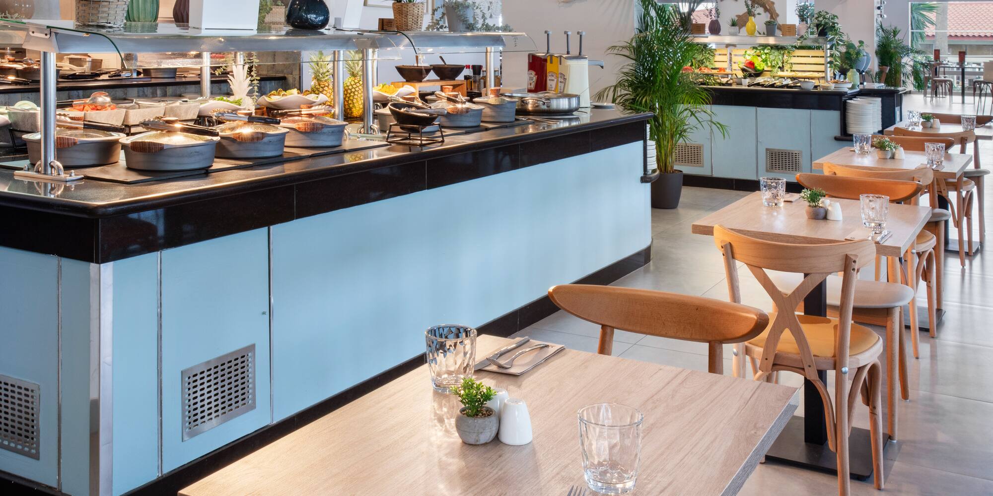 a restaurant with food on the counter