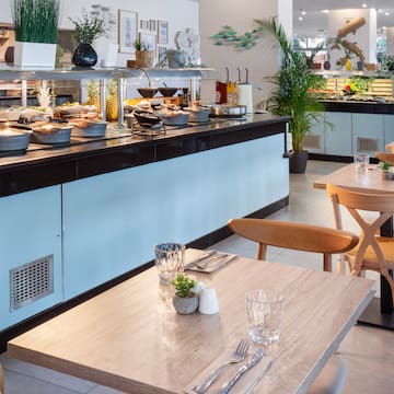 a restaurant with food on the counter