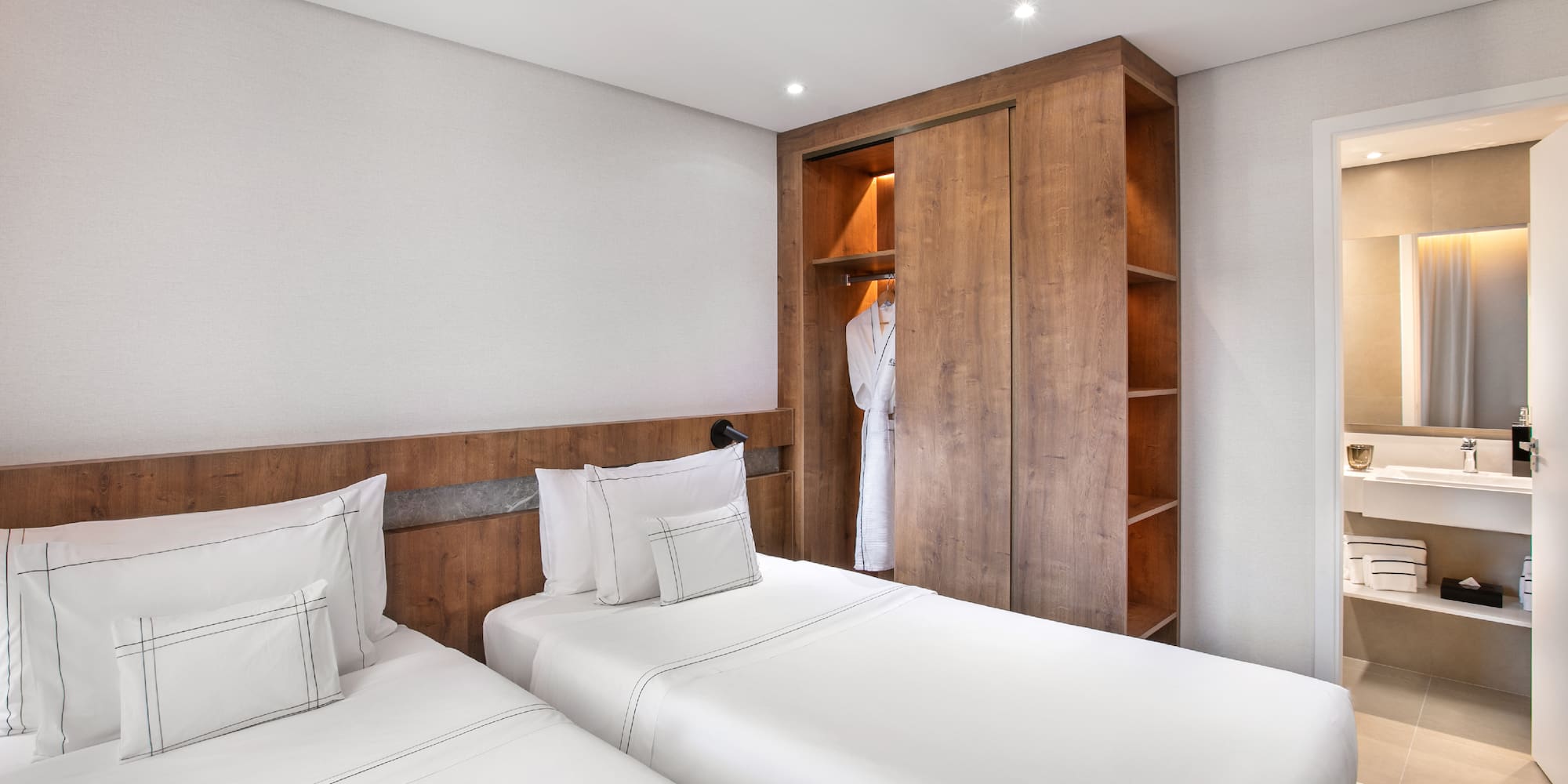 a room with two beds and a closet