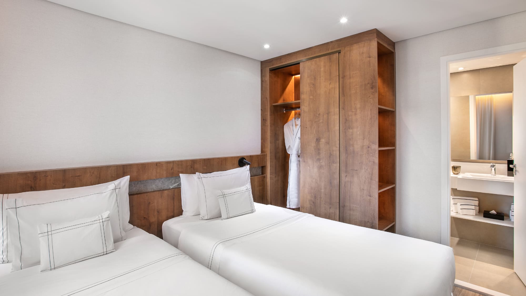 a room with two beds and a closet