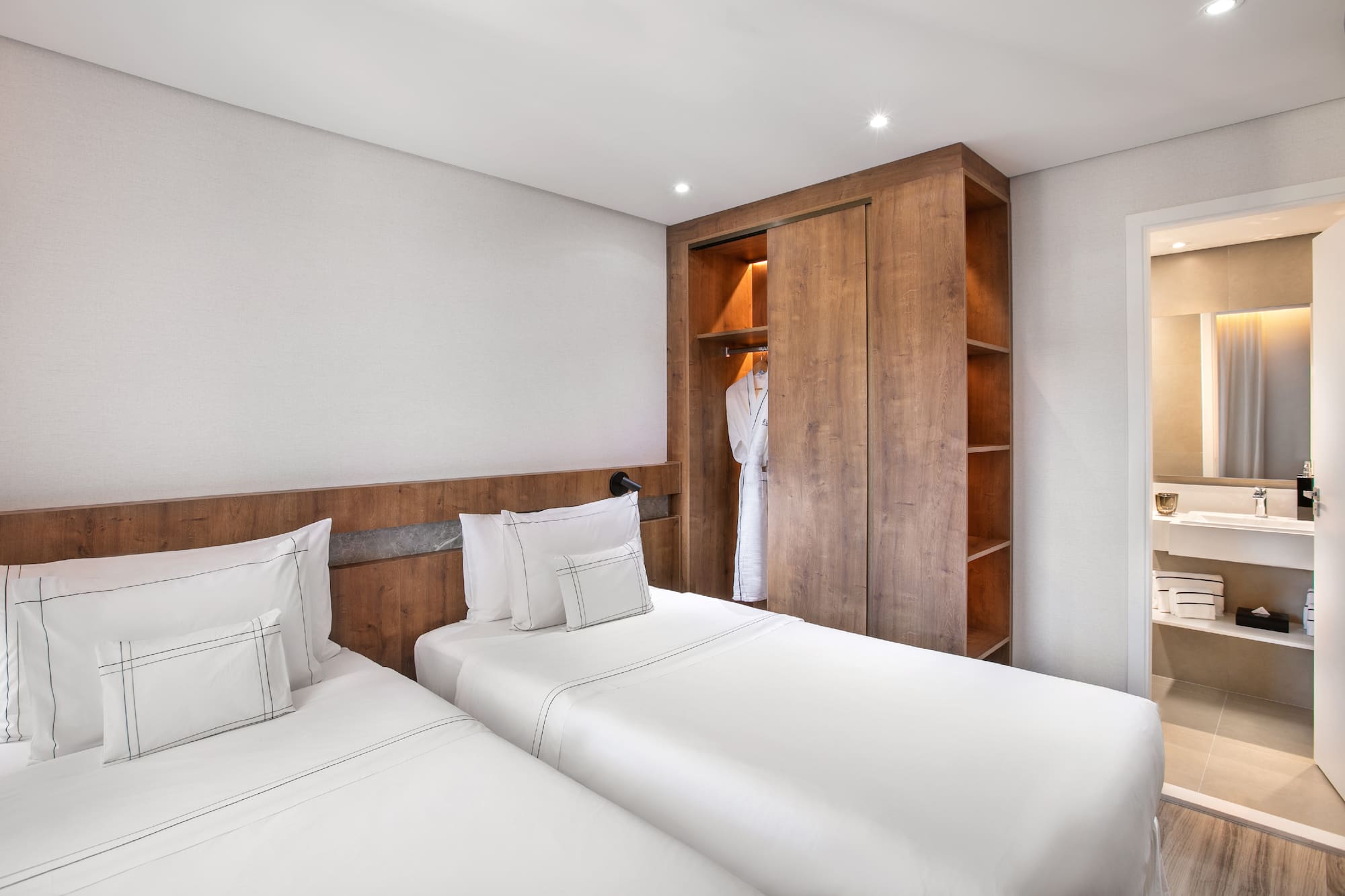 a room with two beds and a closet