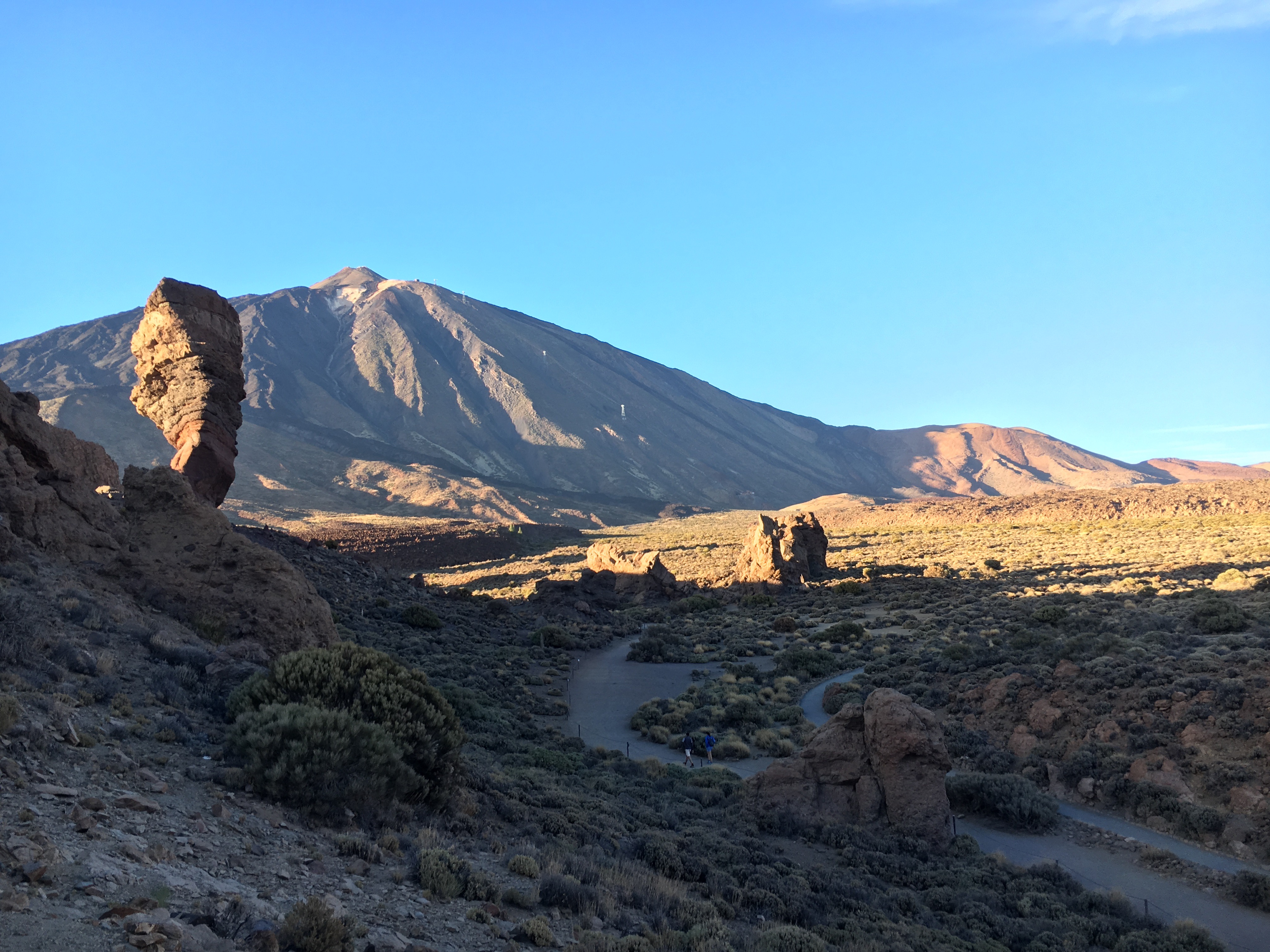 Teide volcano and Roques de García with hikers on a trail in Tenerife.