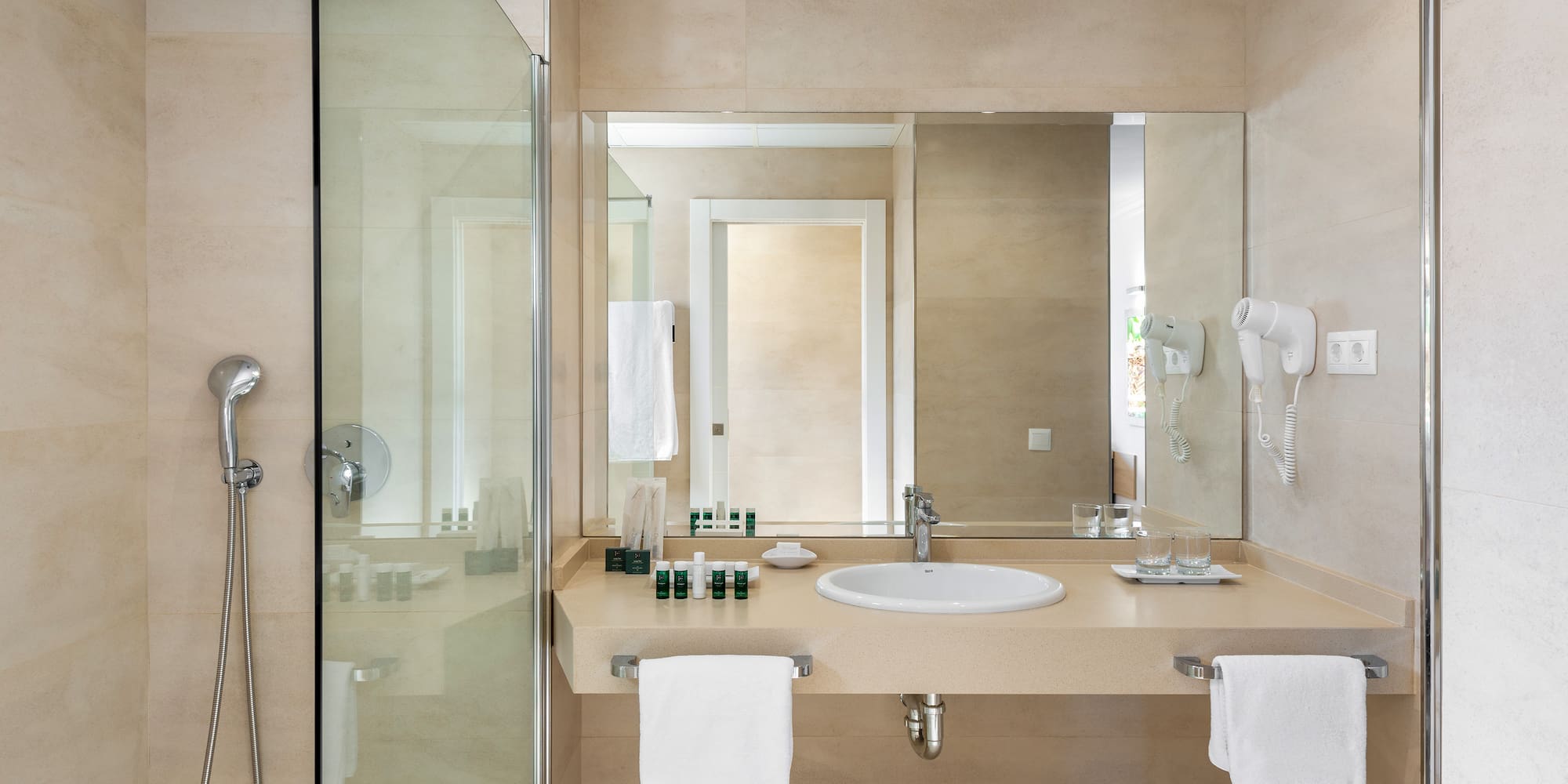 a bathroom with a shower and sink