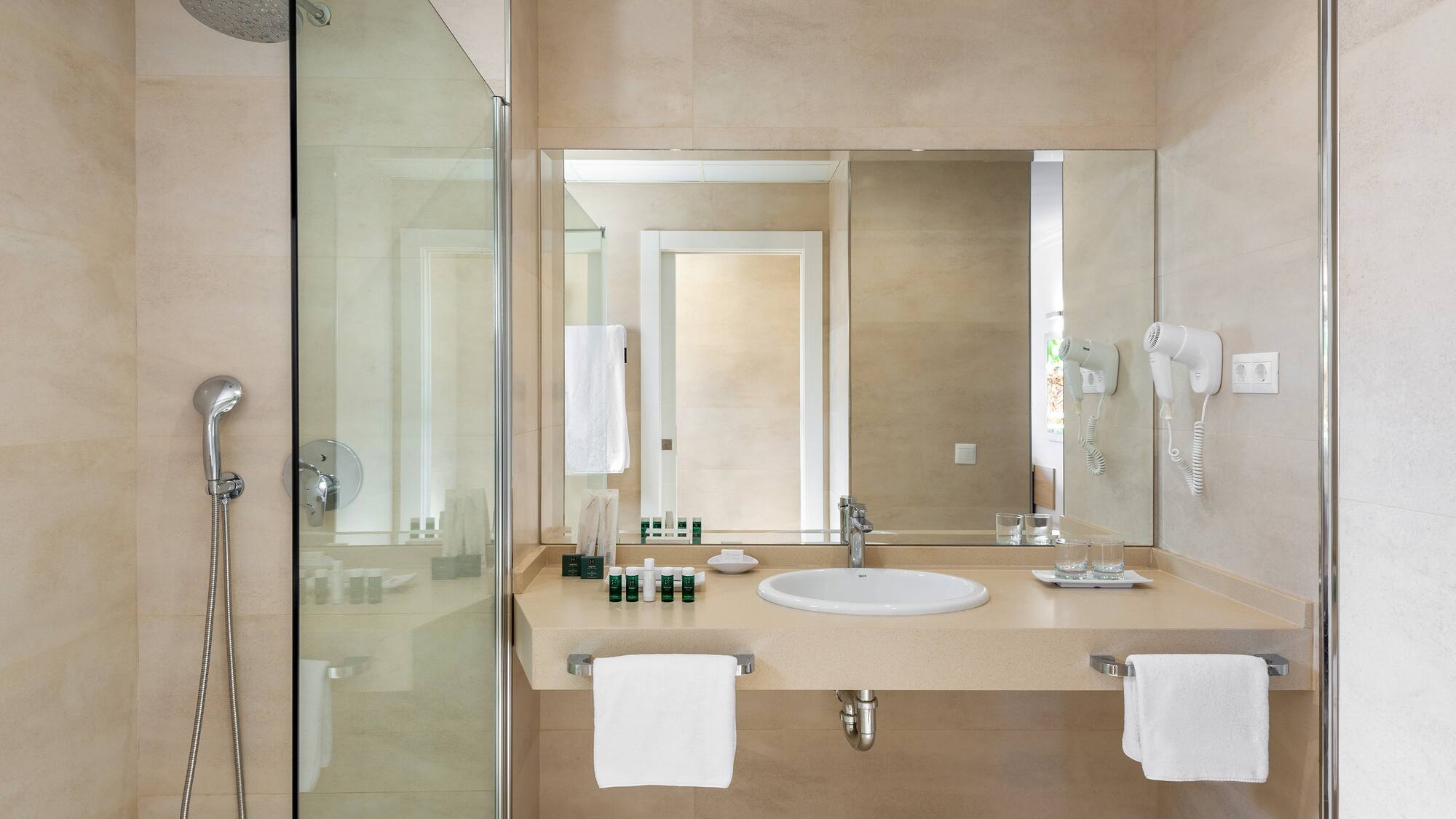 a bathroom with a shower and sink