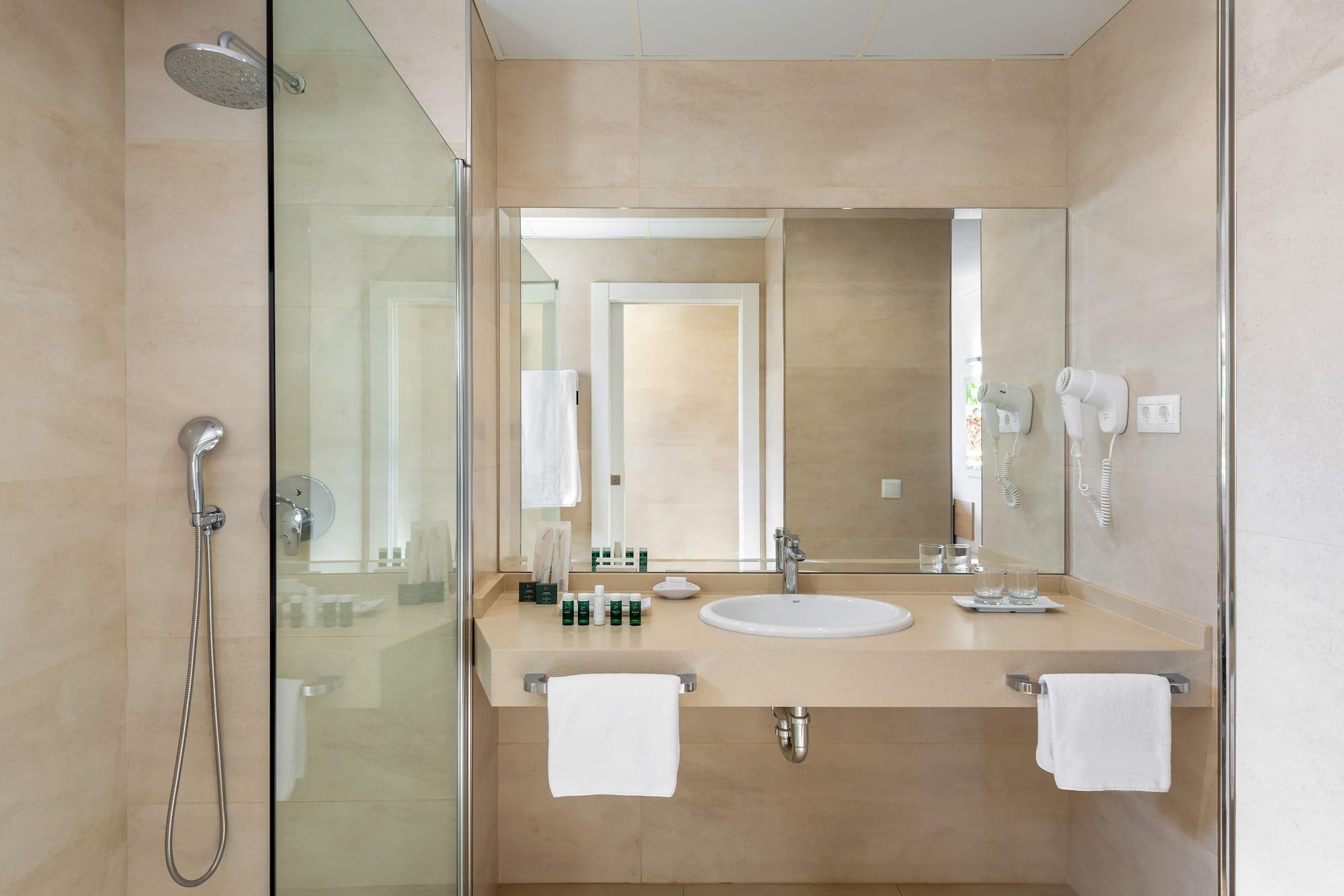 a bathroom with a shower and sink