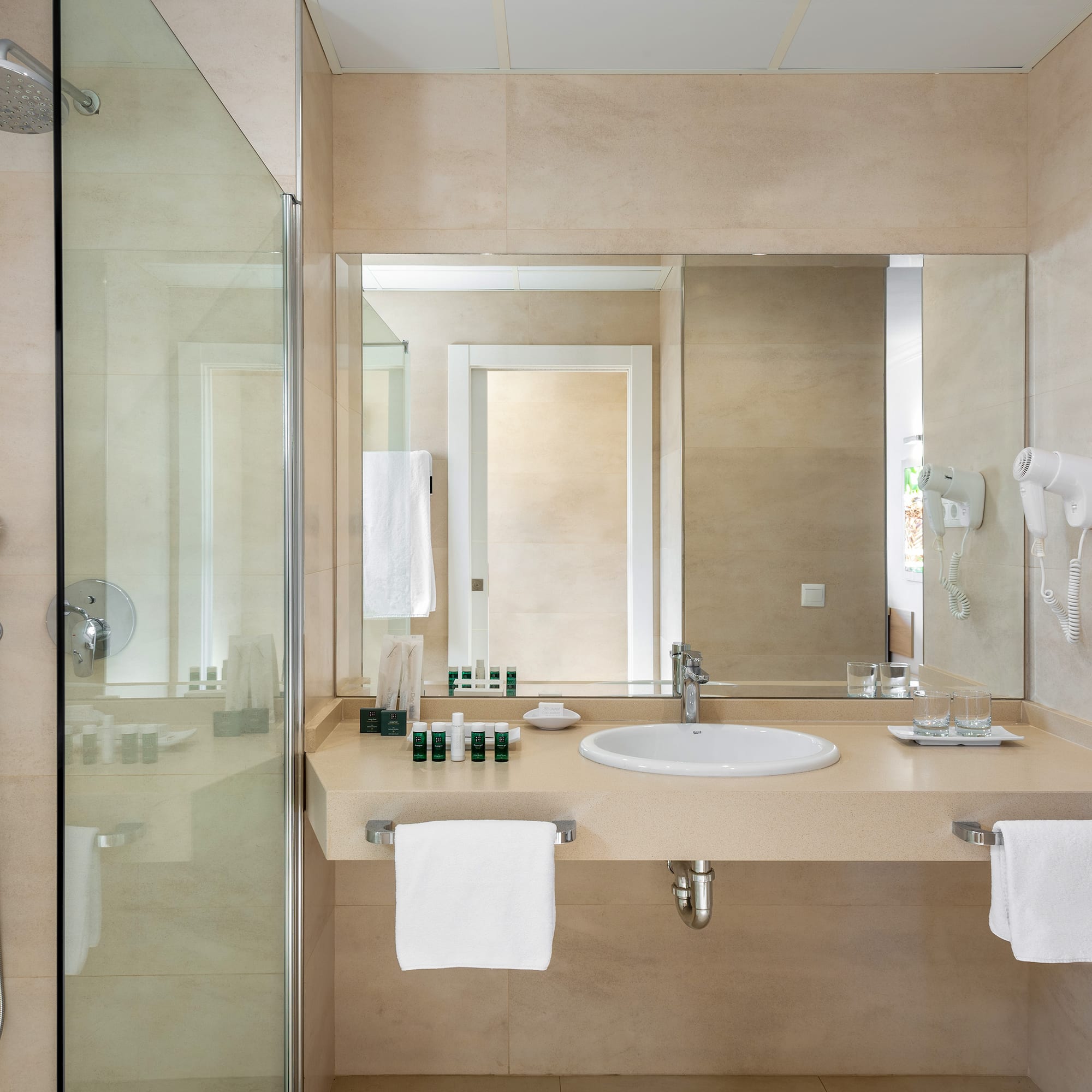 a bathroom with a shower and sink